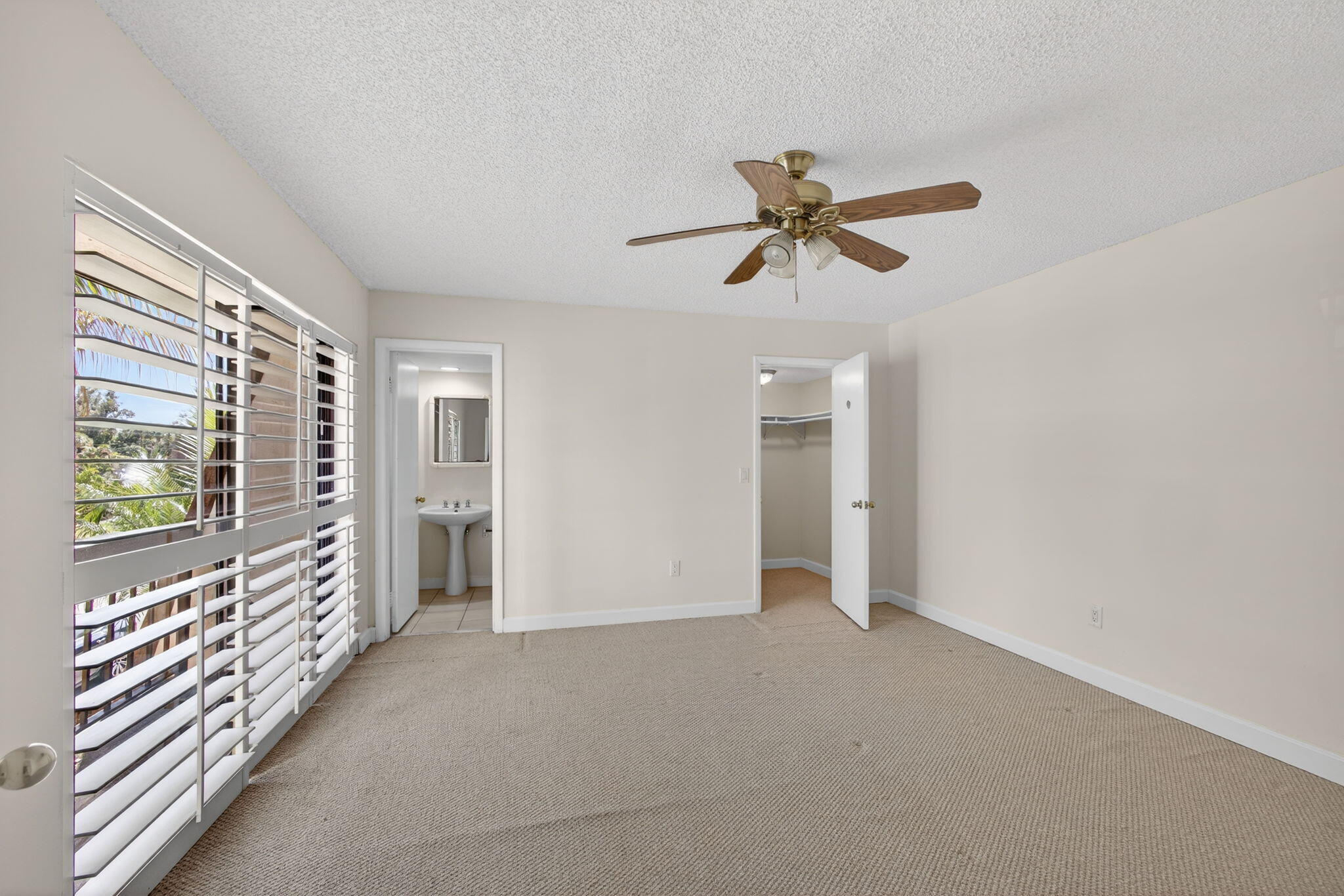 825 Center Street, Unit 9A Jupiter, FL 33458 - Photo 27 of 52 a view of a livingroom with a ceiling fan and window
