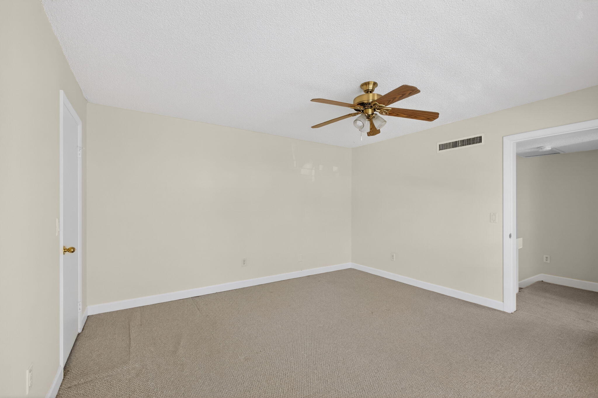 825 Center Street, Unit 9A Jupiter, FL 33458 - Photo 30 of 52 an empty room with a window and a ceiling fan