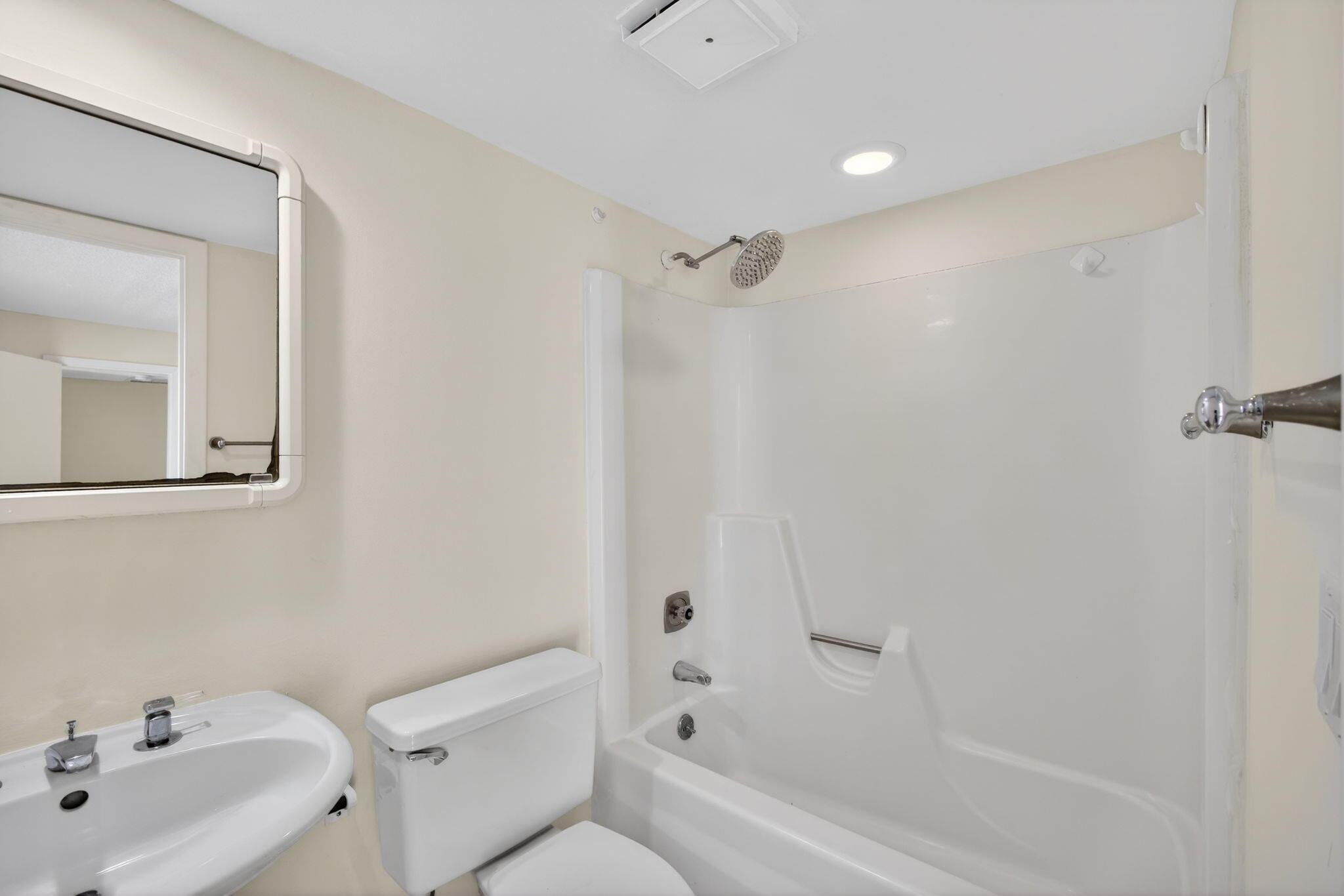 825 Center Street, Unit 9A Jupiter, FL 33458 - Photo 32 of 52 a bathroom with a bathtub shower sink vanity and toilet