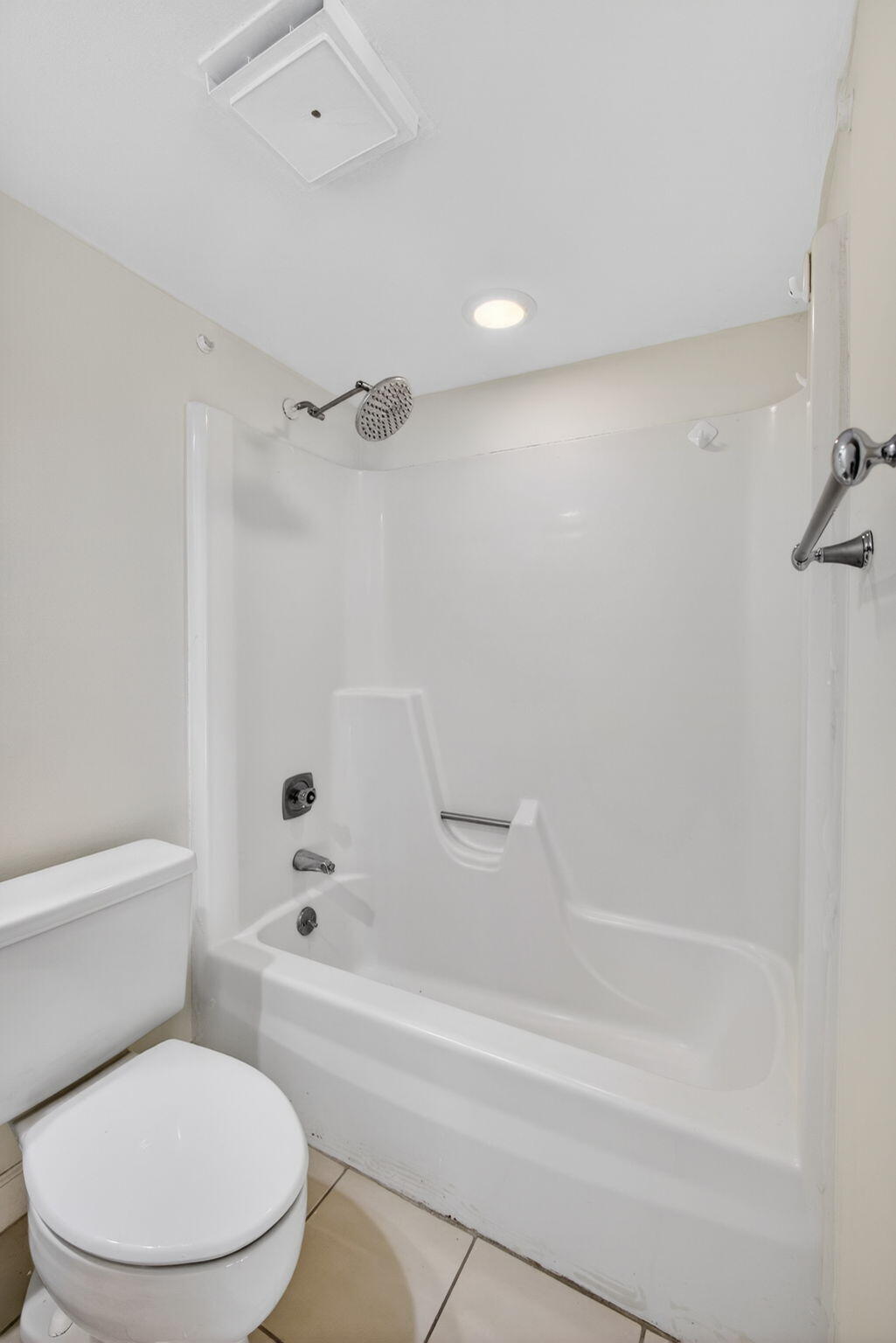 825 Center Street, Unit 9A Jupiter, FL 33458 - Photo 33 of 52 a bathroom with a toilet and a bathtub