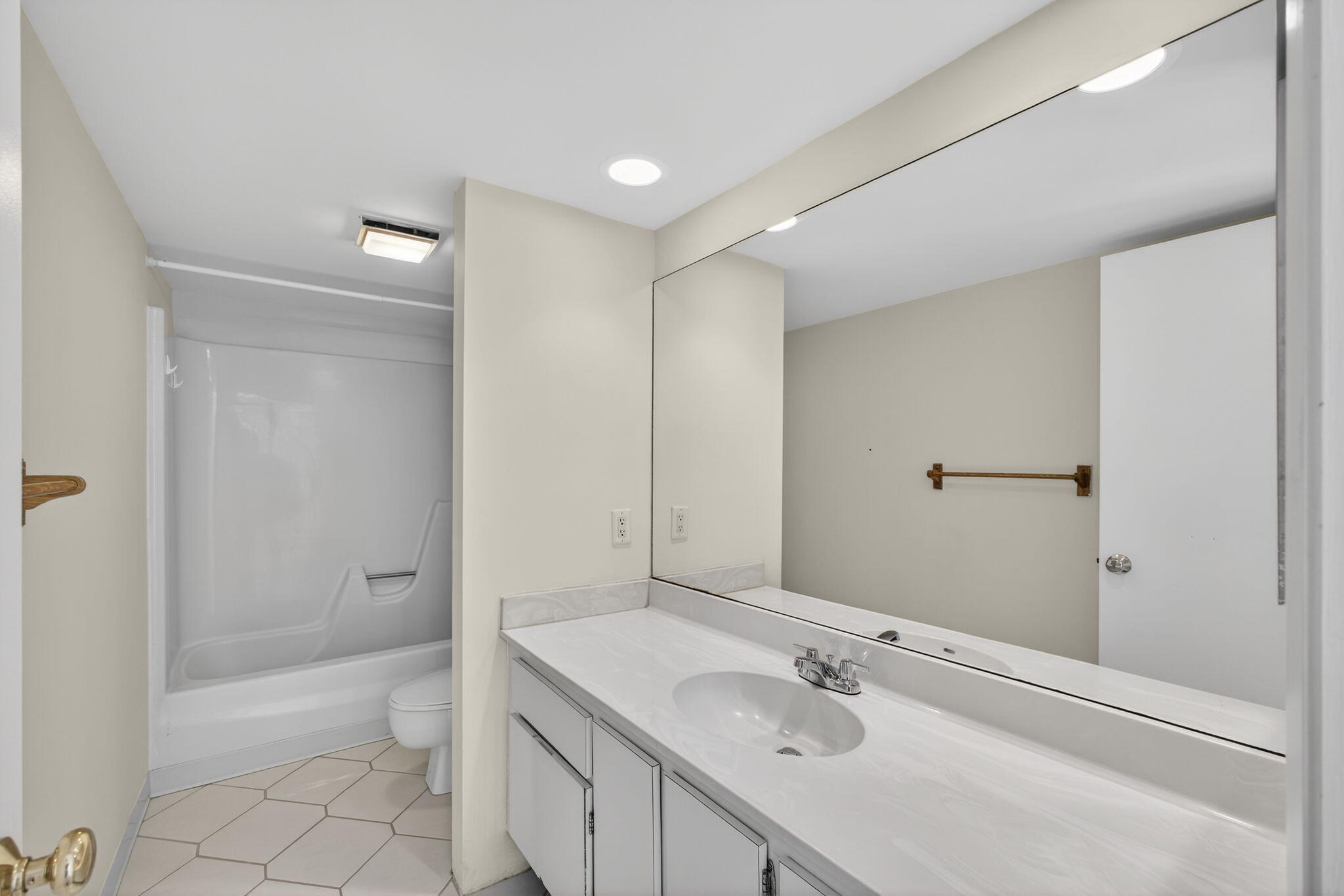 825 Center Street, Unit 9A Jupiter, FL 33458 - Photo 36 of 52 a bathroom with a sink a toilet and shower