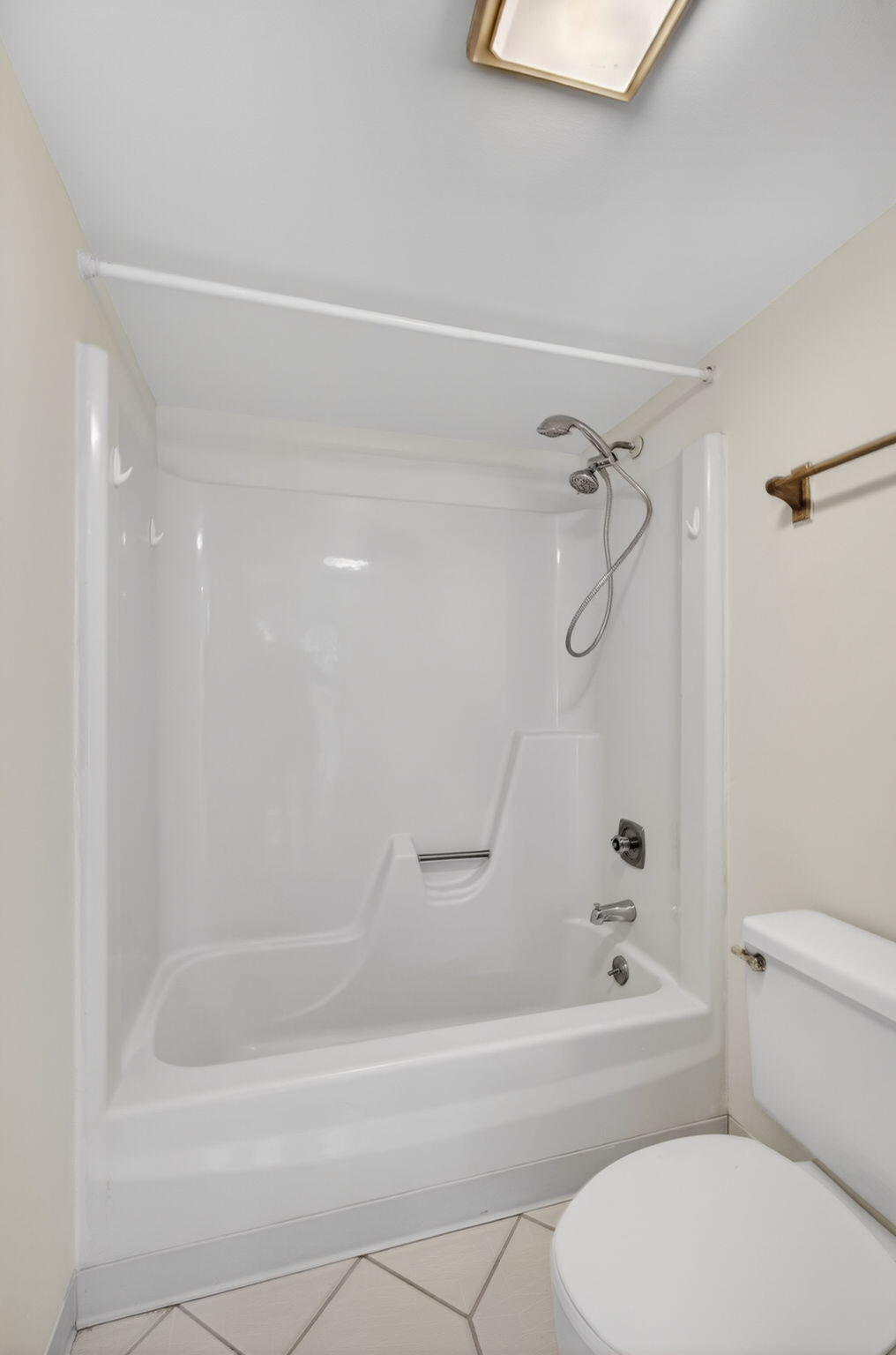 825 Center Street, Unit 9A Jupiter, FL 33458 - Photo 38 of 52 a bathroom with a bathtub and a shower