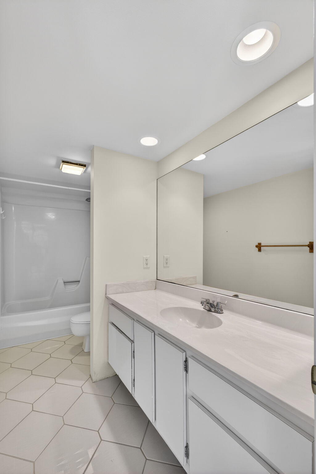 825 Center Street, Unit 9A Jupiter, FL 33458 - Photo 39 of 52 a bathroom with a sink a toilet and shower