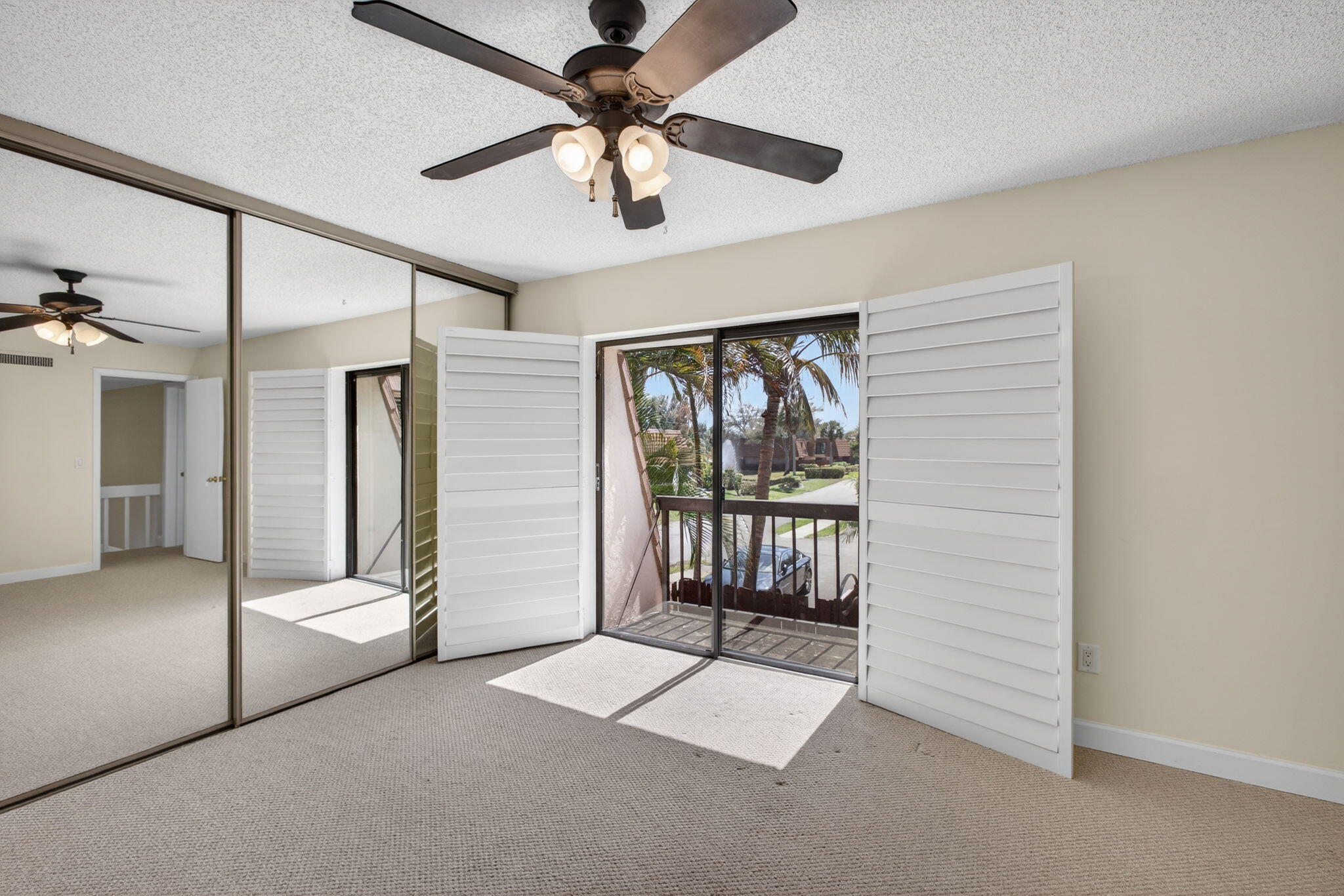 825 Center Street, Unit 9A Jupiter, FL 33458 - Photo 40 of 52 an empty room with windows and fan