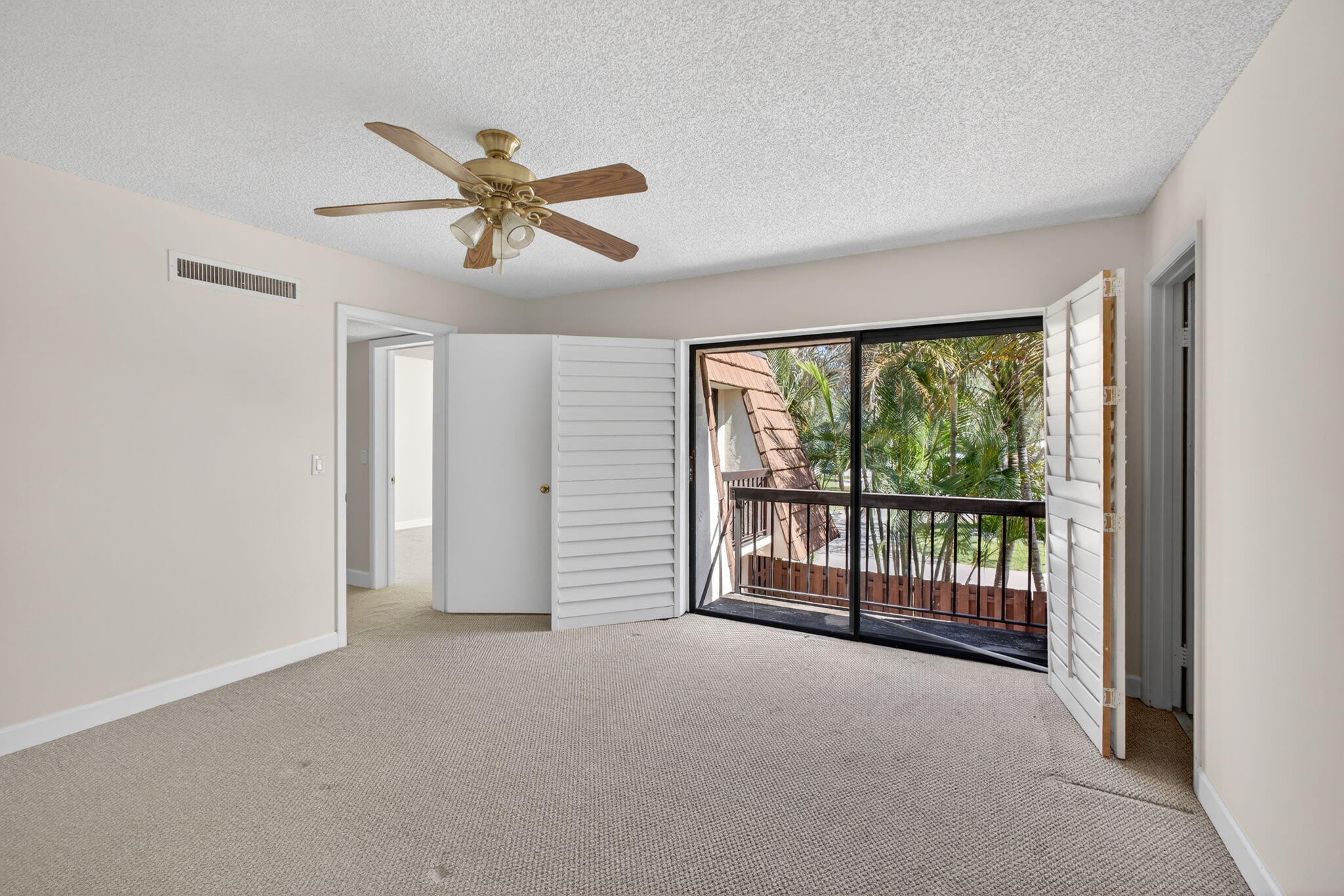 825 Center Street, Unit 9A Jupiter, FL 33458 - Photo 41 of 52 a view of a livingroom with a ceiling fan and window
