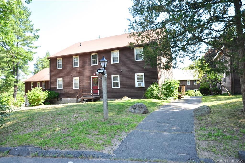 239 Old Farms Road, Unit 10B Avon, CT 06001 - Photo 1 of 1 a front view of a house with a yard and garage