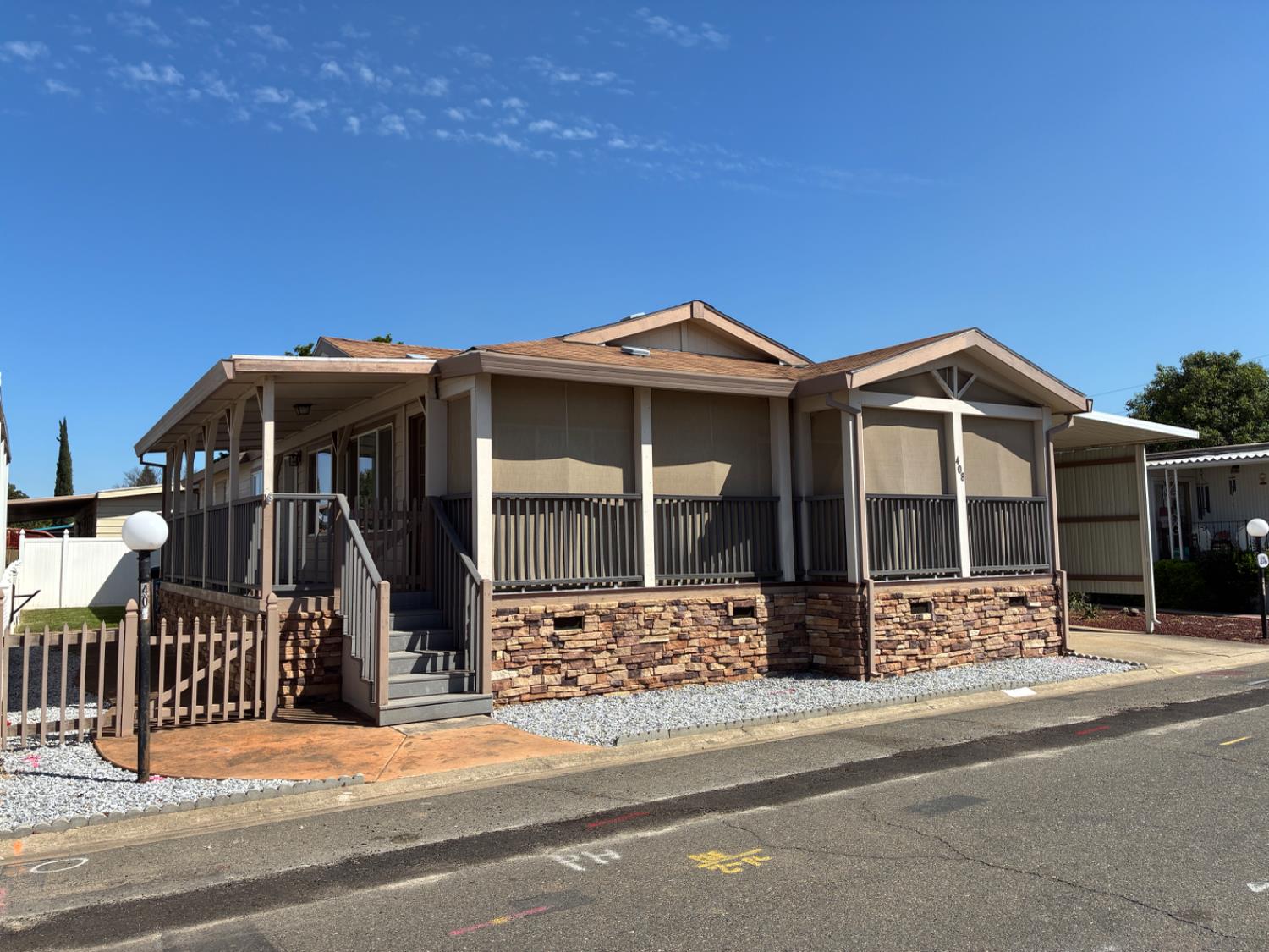 1155 Pease Road, Unit 408 Yuba City, CA 95991 - Photo 1 of 45 a front view of a house with a porch