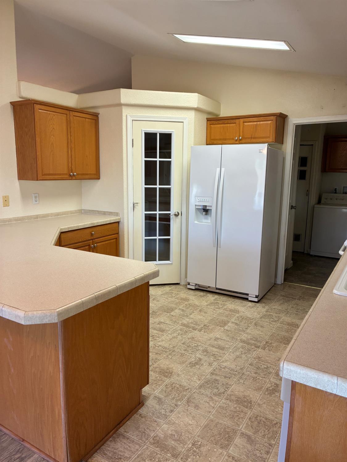 1155 Pease Road, Unit 408 Yuba City, CA 95991 - Photo 12 of 45 a kitchen with stainless steel appliances a refrigerator and a sink