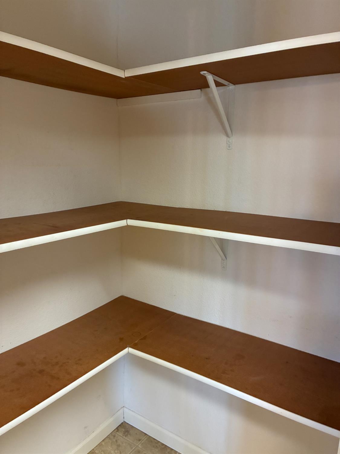 1155 Pease Road, Unit 408 Yuba City, CA 95991 - Photo 13 of 45 a view of a room with racks on the wall