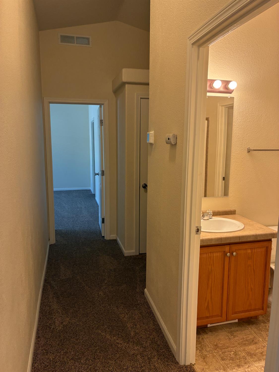 1155 Pease Road, Unit 408 Yuba City, CA 95991 - Photo 18 of 45 a view of a hallway with wooden floor
