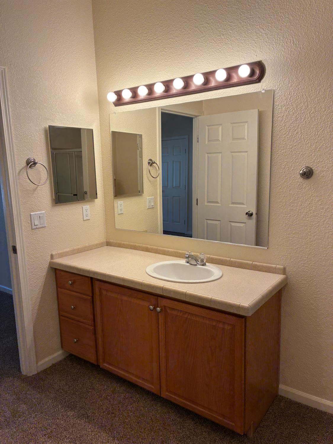 1155 Pease Road, Unit 408 Yuba City, CA 95991 - Photo 30 of 45 a bathroom with a sink and a mirror