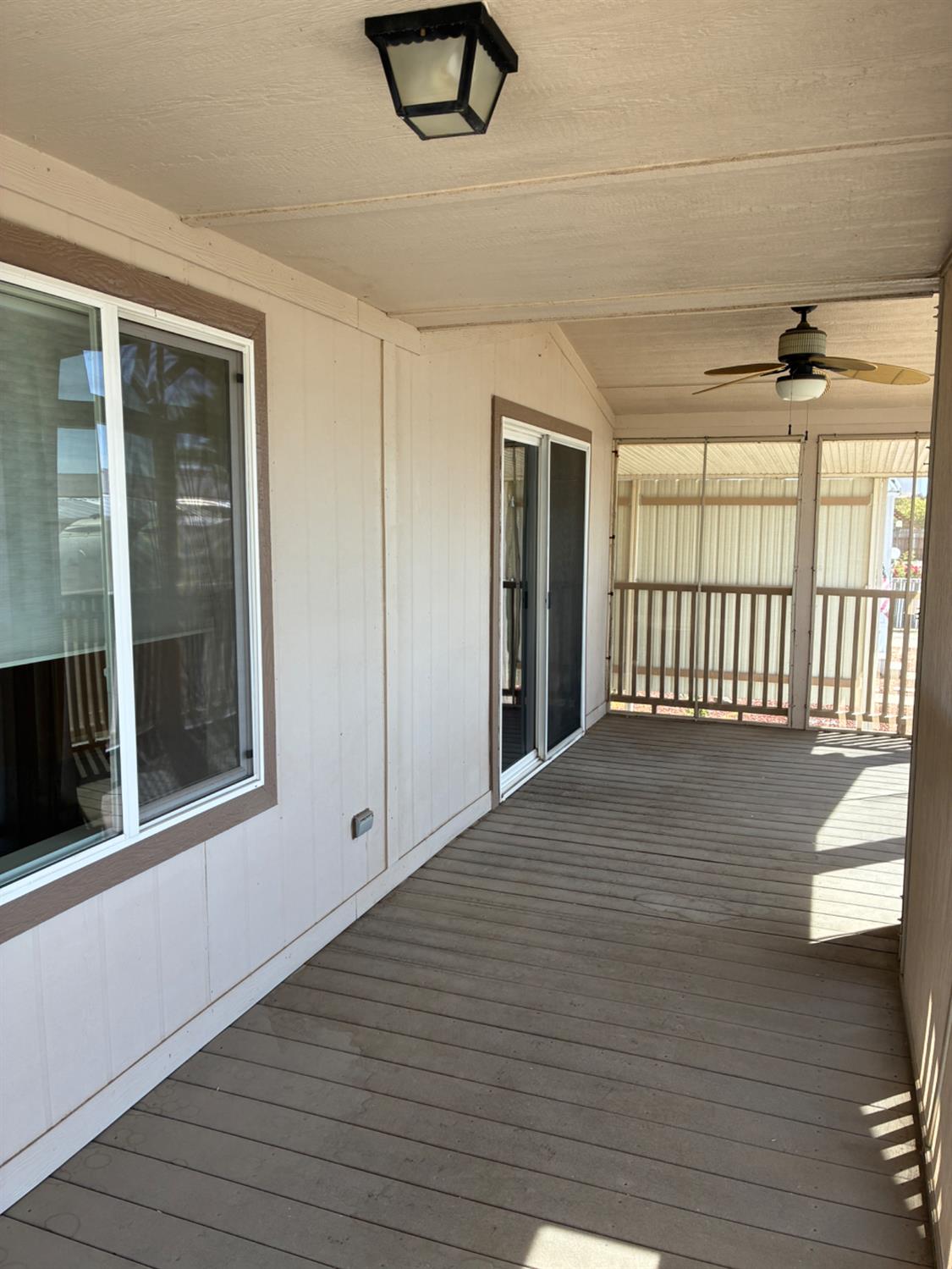 1155 Pease Road, Unit 408 Yuba City, CA 95991 - Photo 38 of 45 a view of an empty room with wooden floor and a window