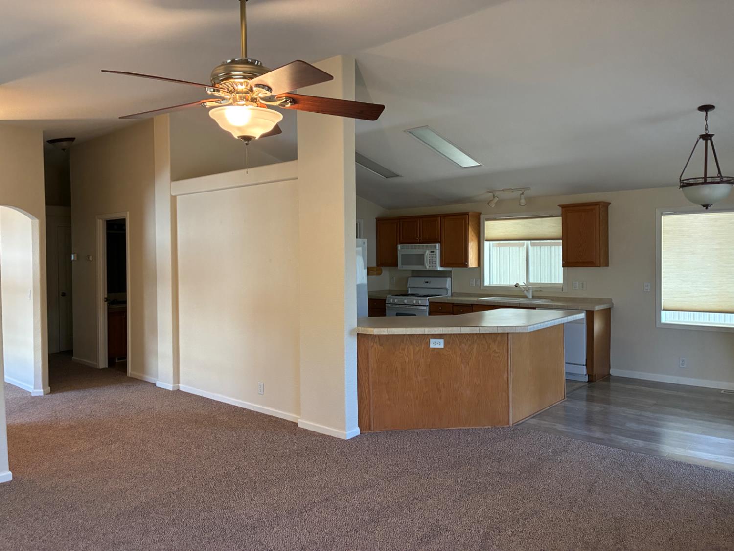 1155 Pease Road, Unit 408 Yuba City, CA 95991 - Photo 5 of 45 a large kitchen with kitchen island a sink stainless steel appliances and cabinets