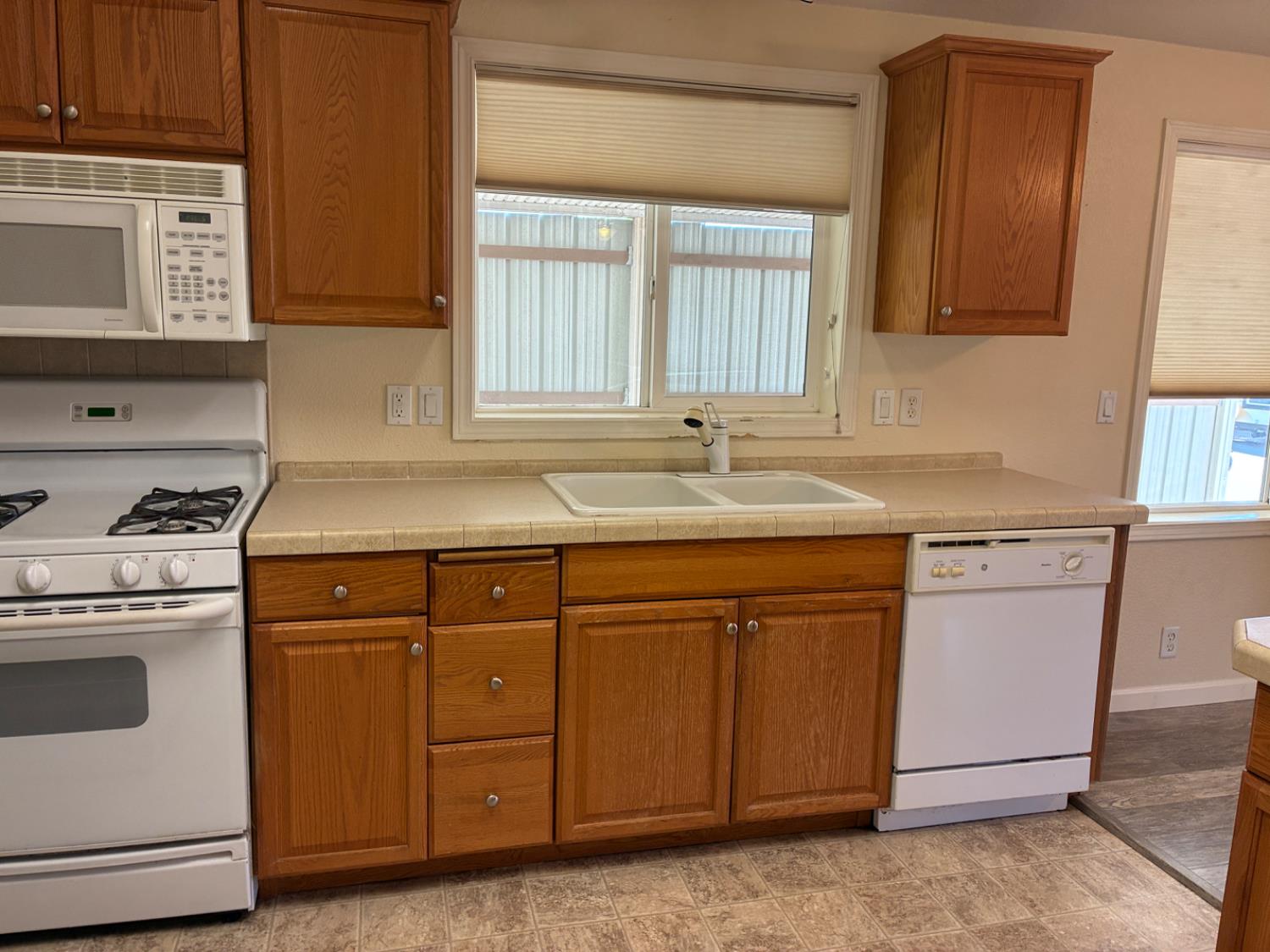 1155 Pease Road, Unit 408 Yuba City, CA 95991 - Photo 10 of 45 a kitchen with stainless steel appliances granite countertop a sink stove and cabinets