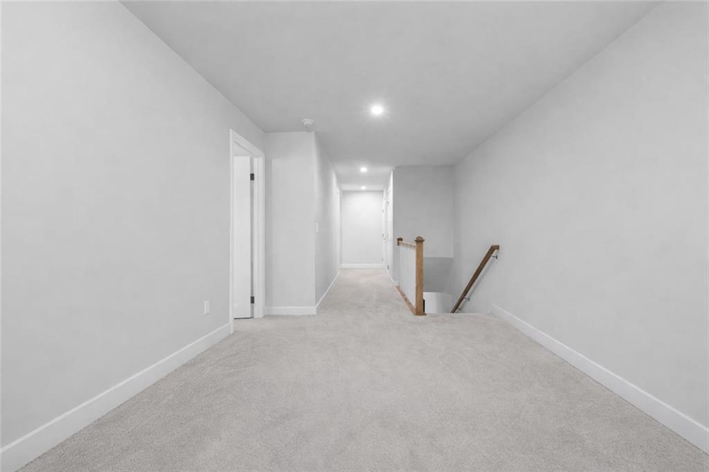 116 Salt Lk Lane Hoschton, GA 30548 - Photo 12 of 17 a view of a big room with windows