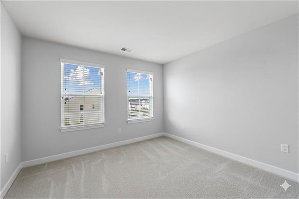 116 Salt Lk Lane Hoschton, GA 30548 - Photo 13 of 17 an empty room with windows