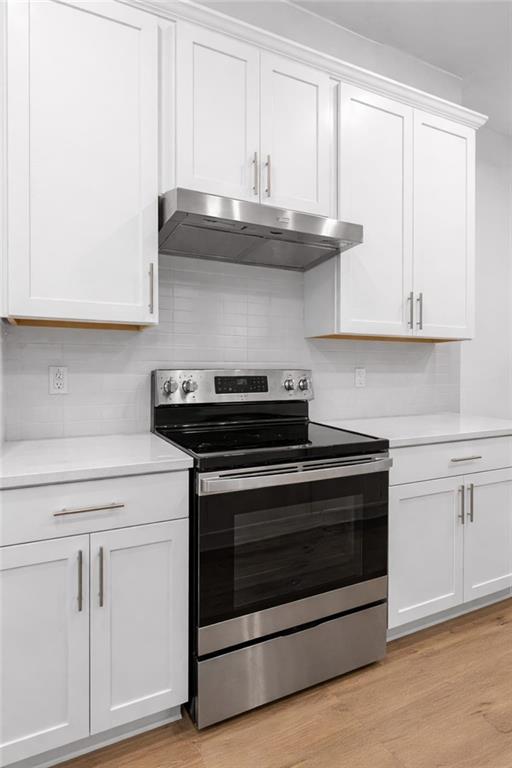 116 Salt Lk Lane Hoschton, GA 30548 - Photo 5 of 17 a stove top oven sitting inside of a kitchen
