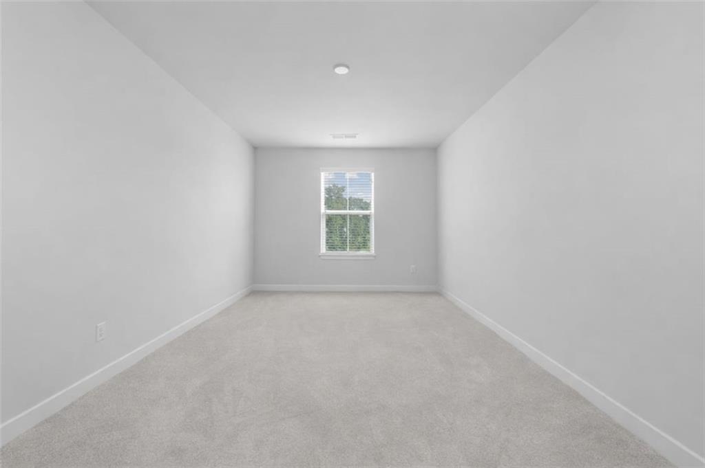 116 Salt Lk Lane Hoschton, GA 30548 - Photo 8 of 17 an empty room with windows