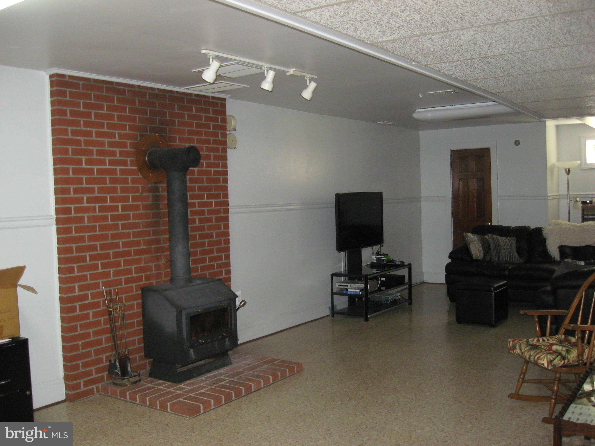 1590 Lottie Fowler Road Prince Frederick, MD 20678 - Photo 26 of 30 Finished Rec Room w/wood stove
