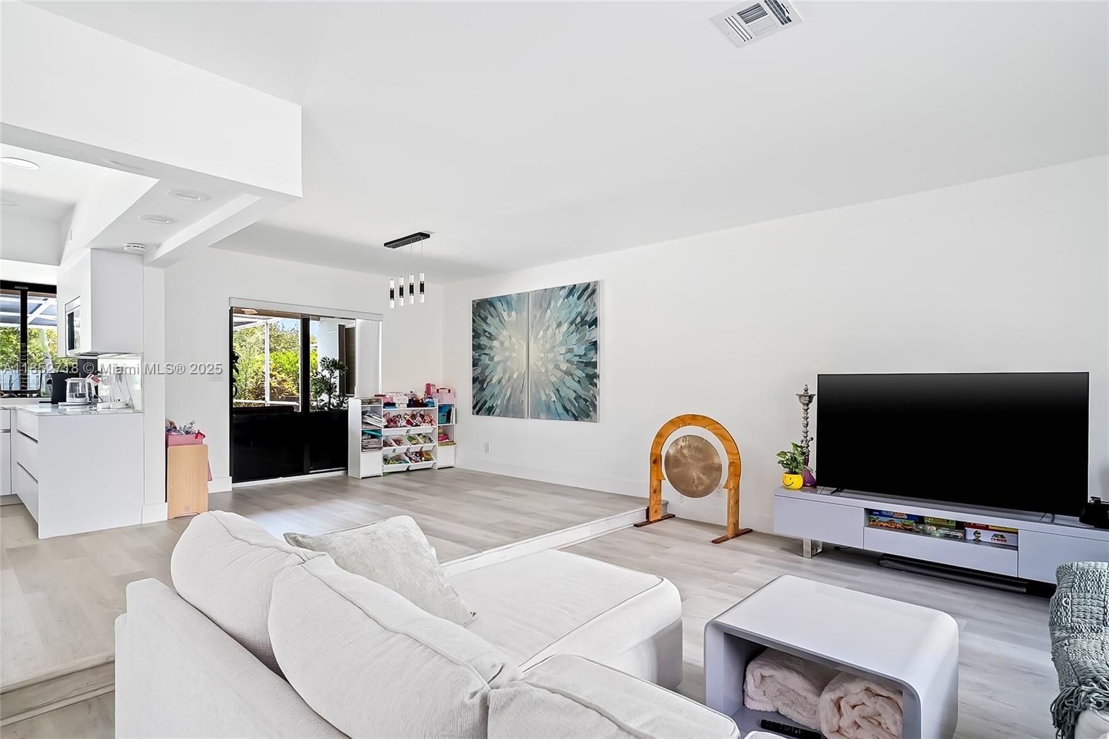 5100 Arthur Street Hollywood, FL 33021 - Photo 16 of 54 a bedroom with furniture and a flat screen tv