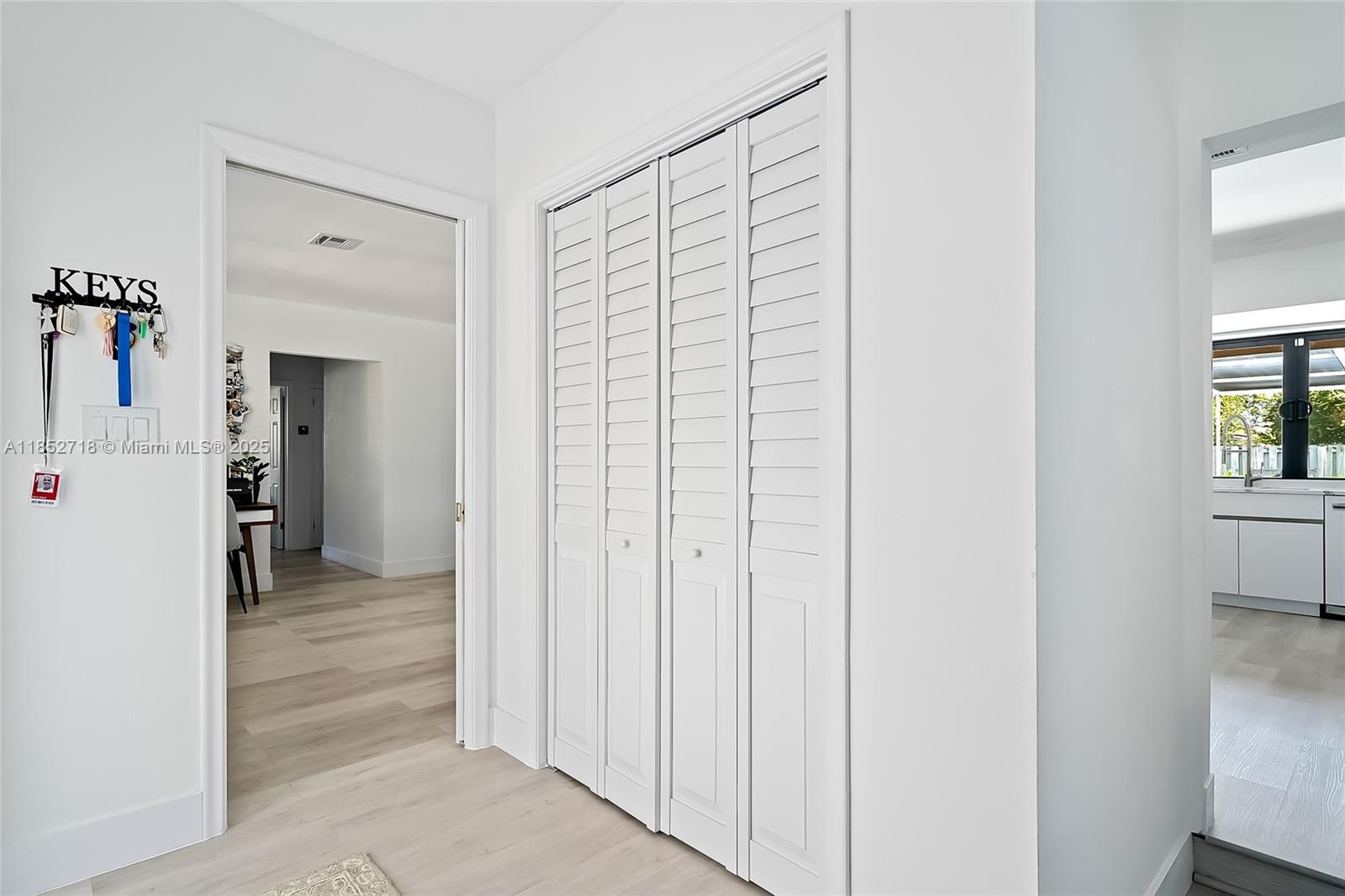 5100 Arthur Street Hollywood, FL 33021 - Photo 17 of 54 a view of a hallway with wooden shelves
