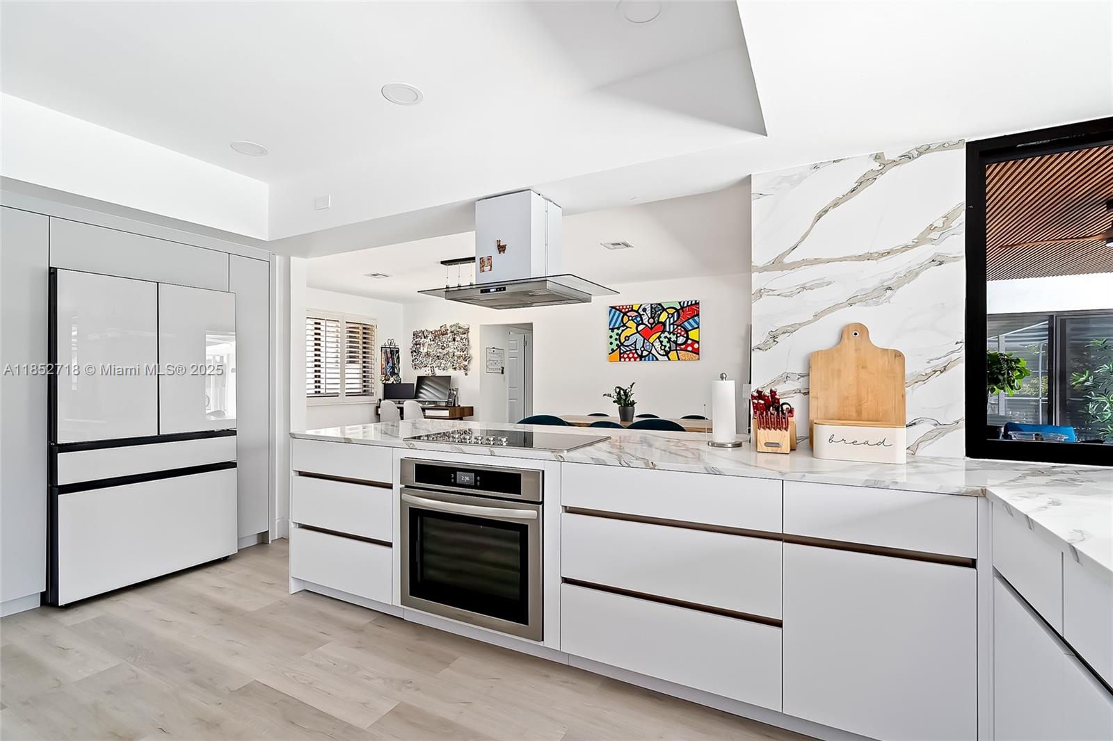 5100 Arthur Street Hollywood, FL 33021 - Photo 2 of 54 a kitchen with a stove and a refrigerator