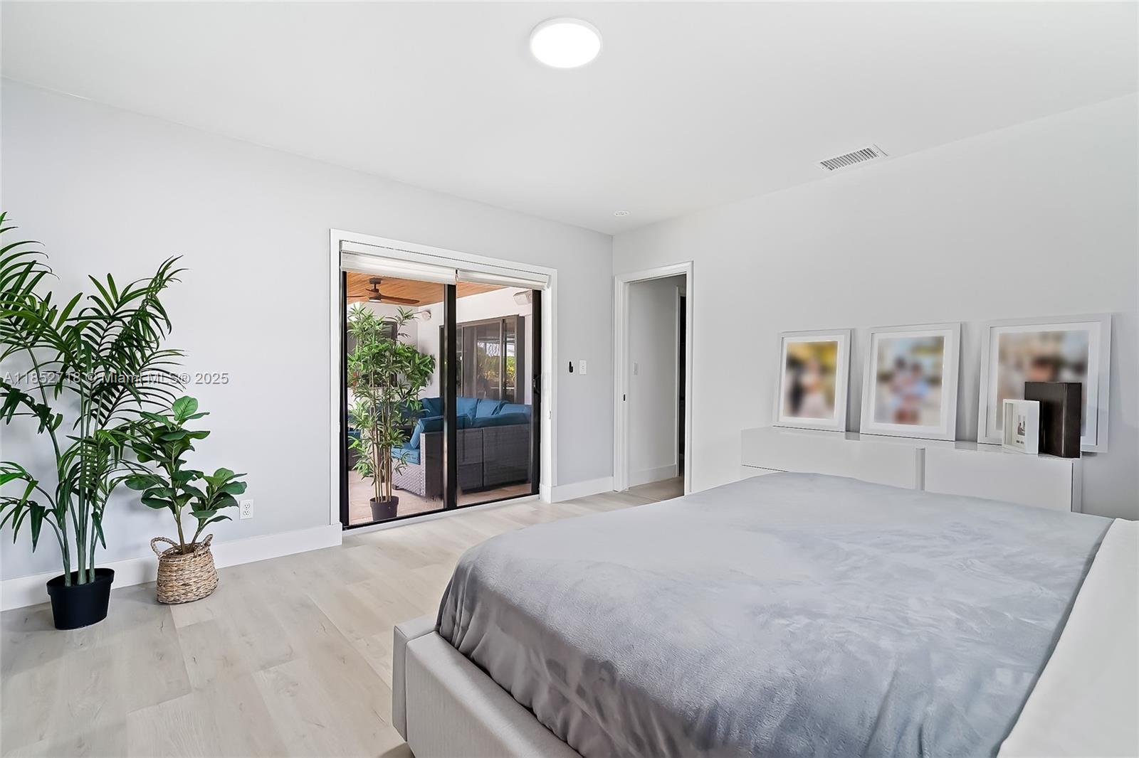 5100 Arthur Street Hollywood, FL 33021 - Photo 21 of 54 a large white bed in a bedroom next to a window