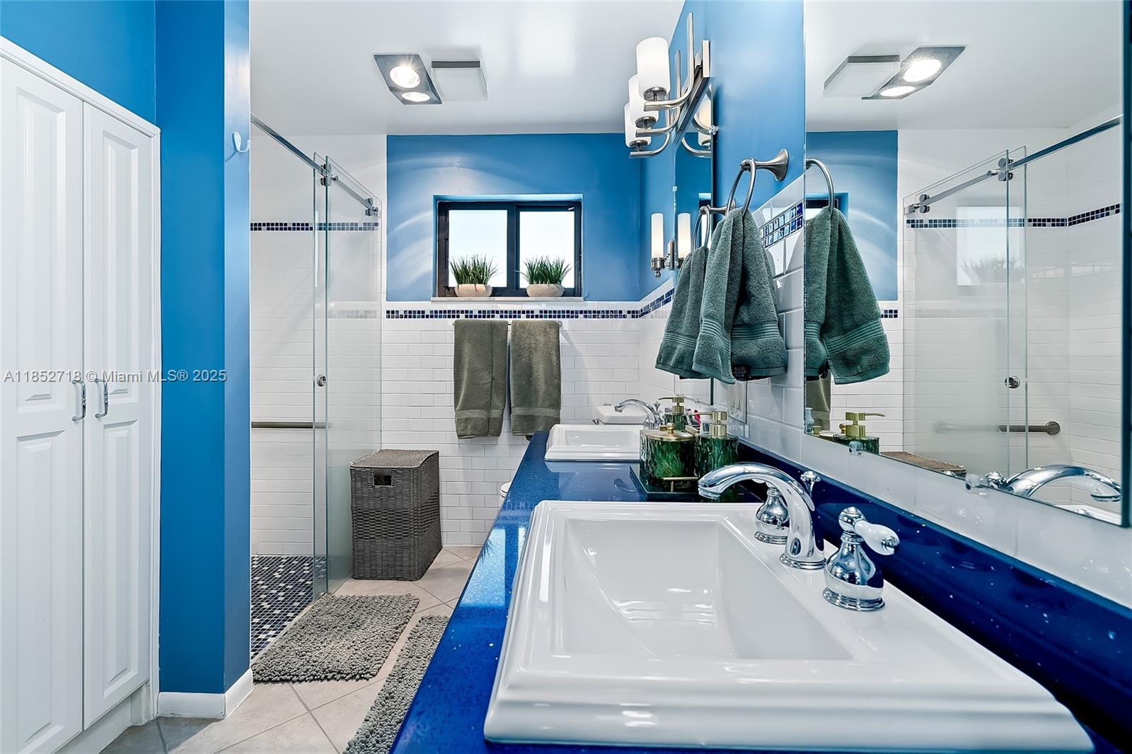 5100 Arthur Street Hollywood, FL 33021 - Photo 24 of 54 a bathroom with a sink and a mirror