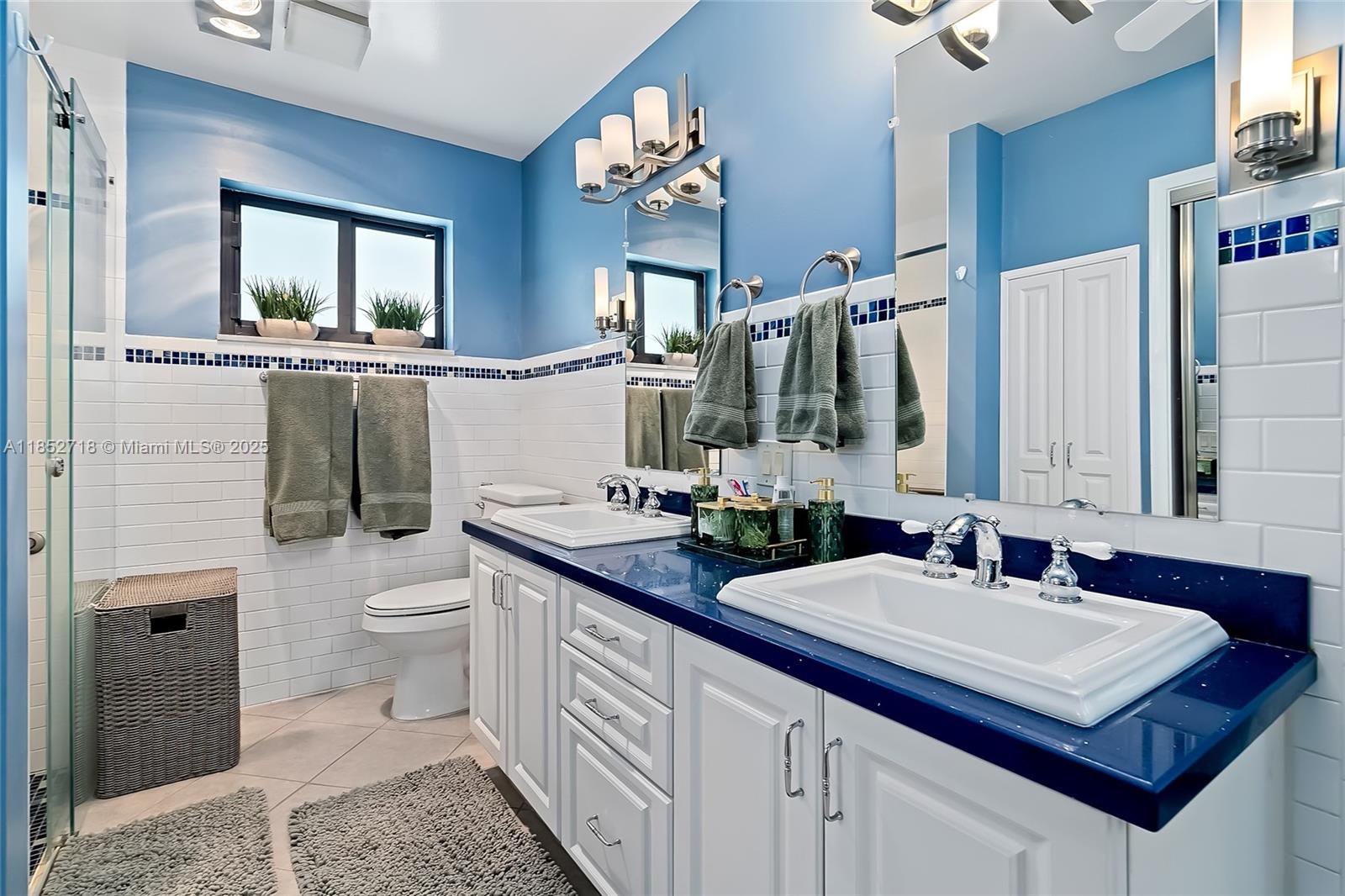 5100 Arthur Street Hollywood, FL 33021 - Photo 25 of 54 a bathroom with a sink a toilet and mirror