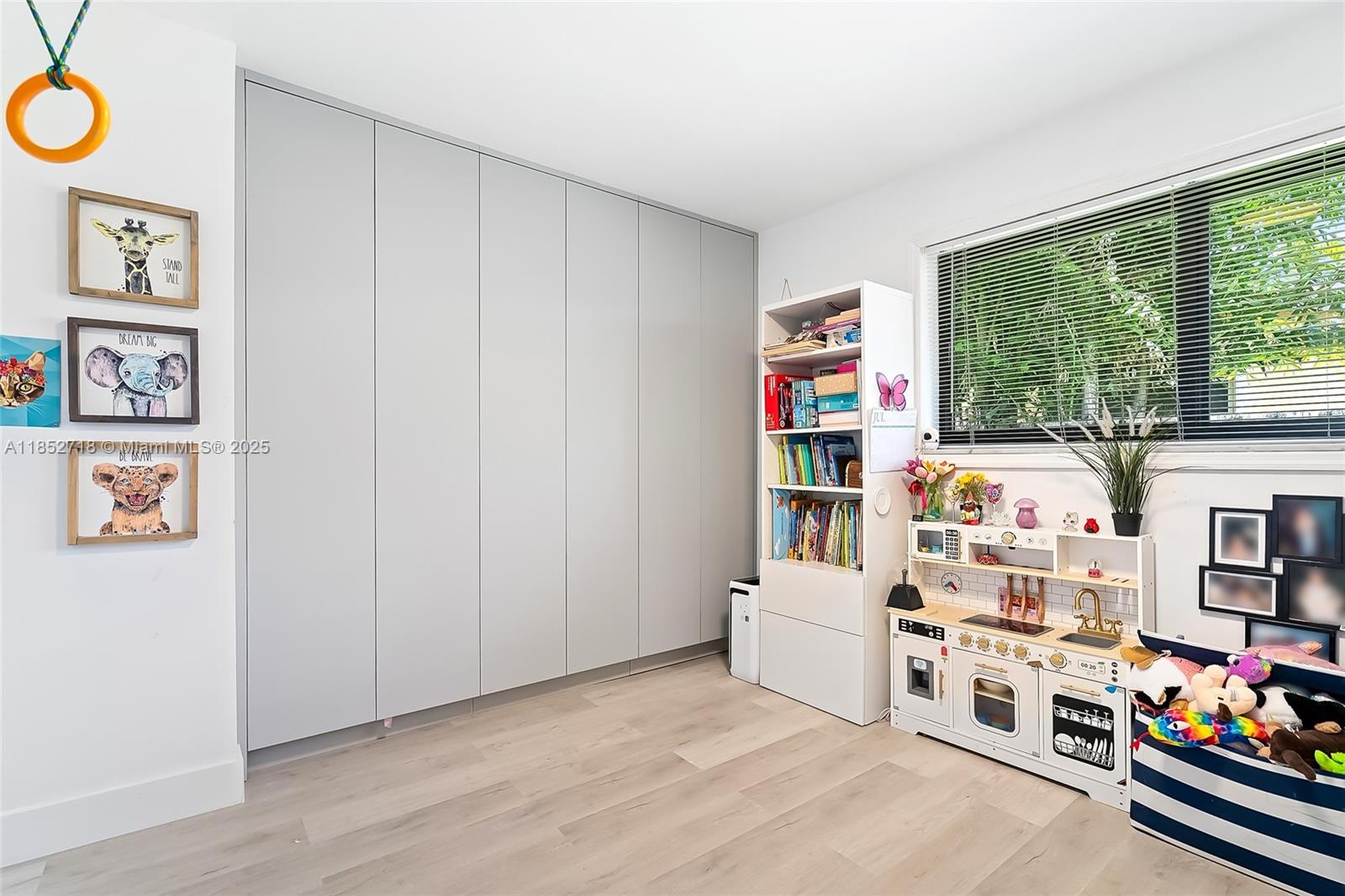 5100 Arthur Street Hollywood, FL 33021 - Photo 27 of 54 a room with furniture a white walls and a window