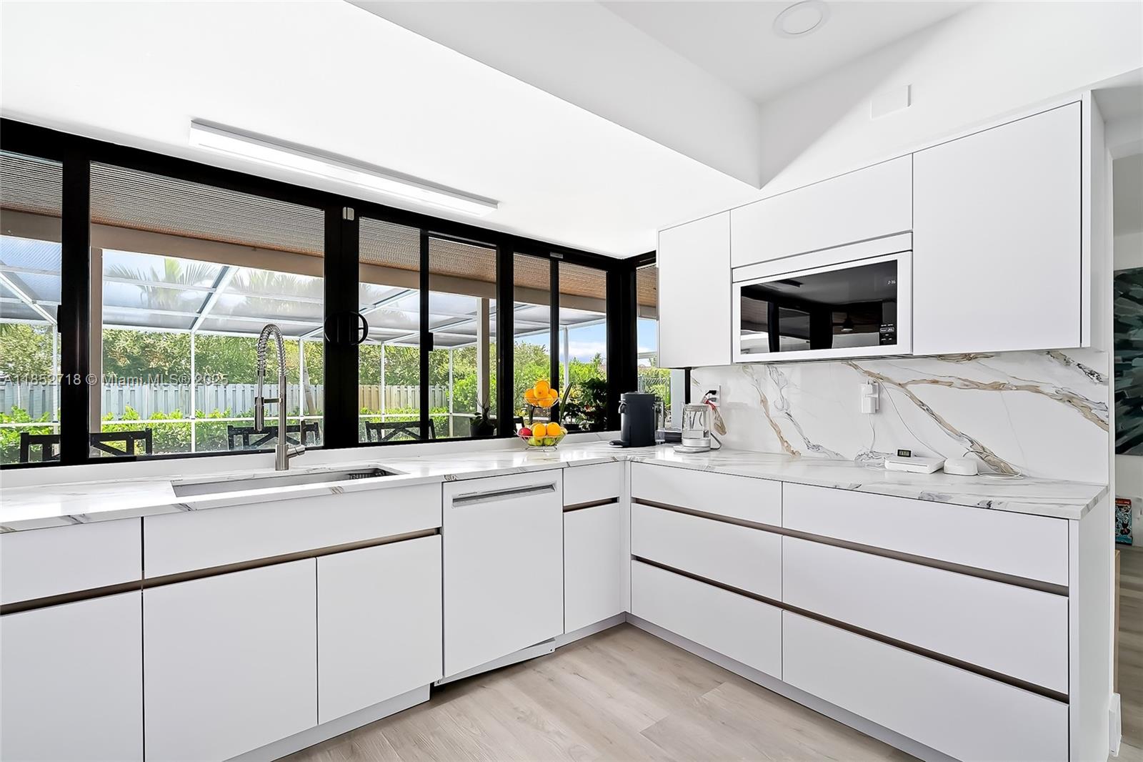 5100 Arthur Street Hollywood, FL 33021 - Photo 3 of 54 a view of living room with furniture and flat screen tv