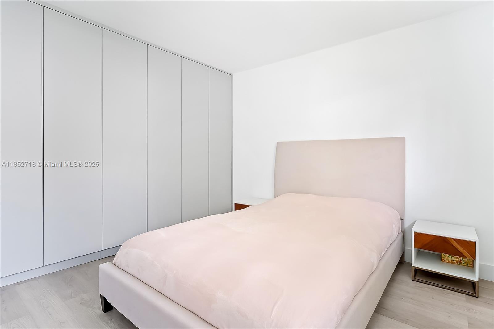 5100 Arthur Street Hollywood, FL 33021 - Photo 32 of 54 a large bed sitting in a bedroom next to a window