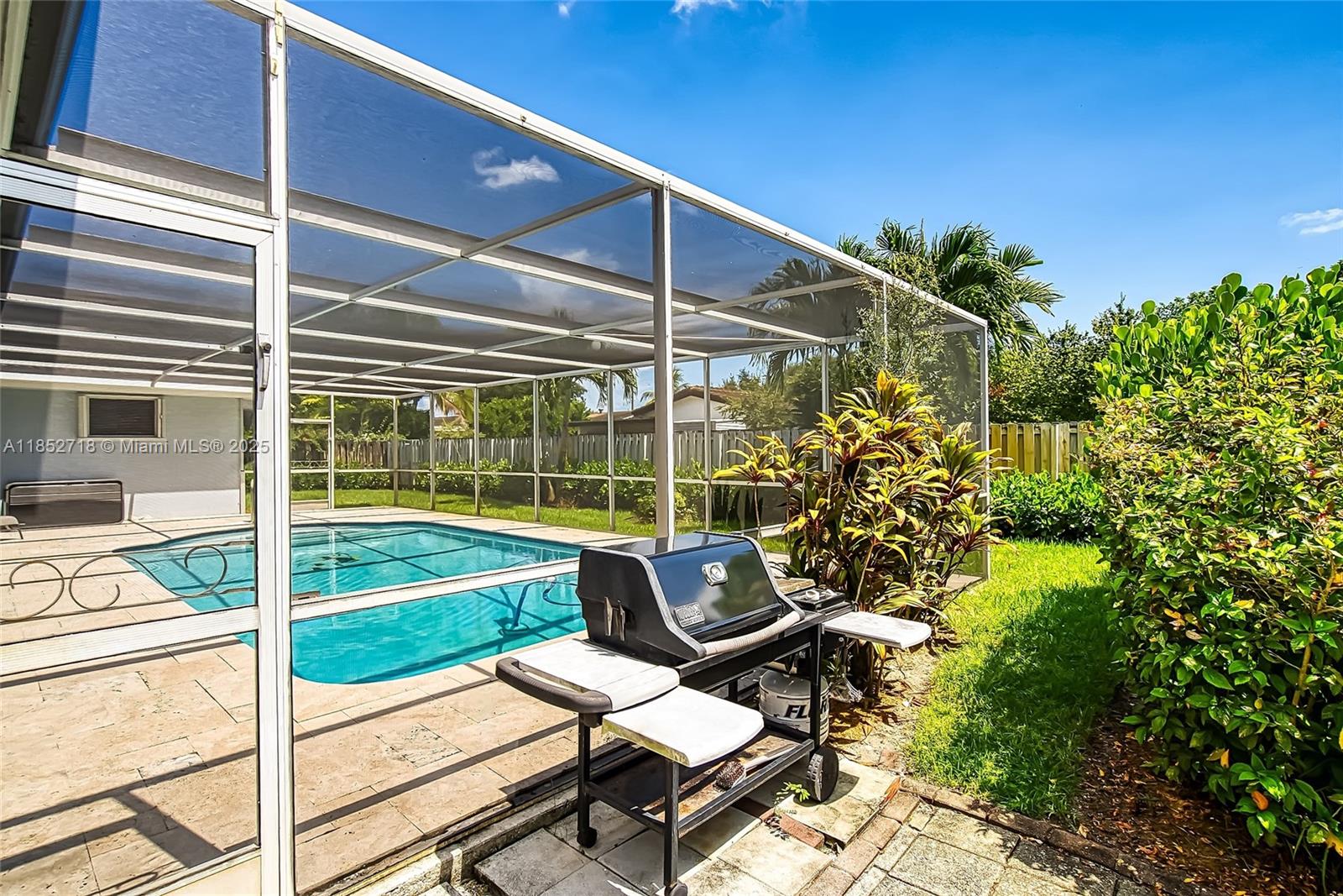 5100 Arthur Street Hollywood, FL 33021 - Photo 41 of 54 a view of a chairs and table in the patio with a backyard