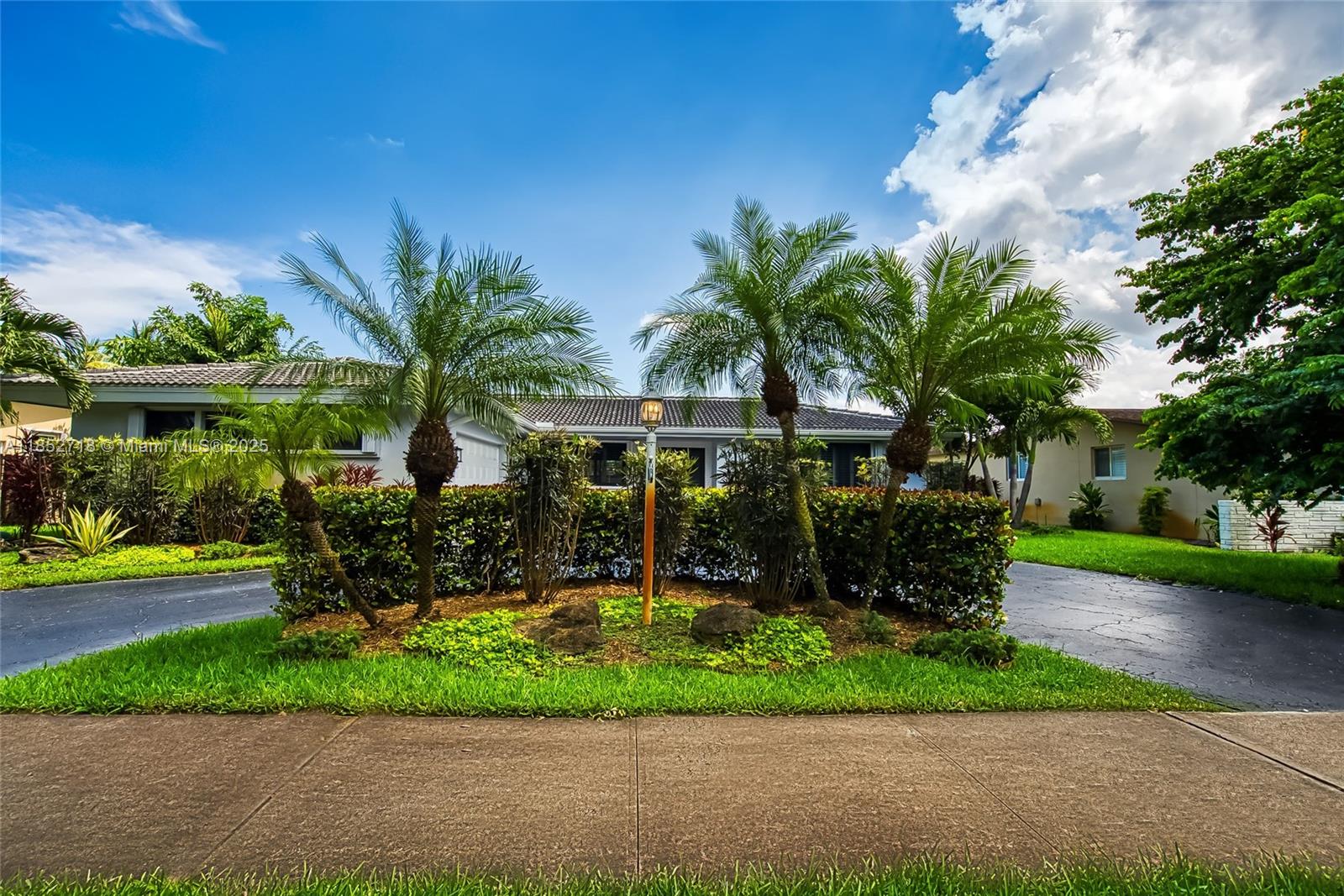 5100 Arthur Street Hollywood, FL 33021 - Photo 48 of 54 a front view of a house with garden