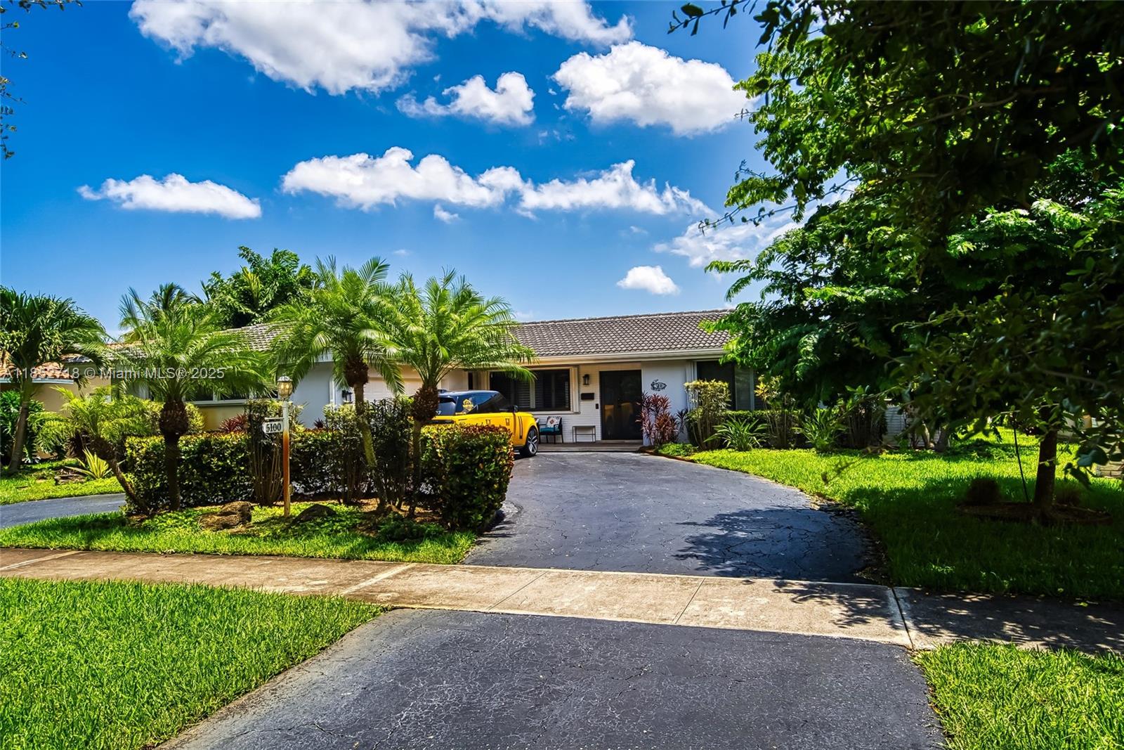 5100 Arthur Street Hollywood, FL 33021 - Photo 50 of 54 a front view of a house with garden