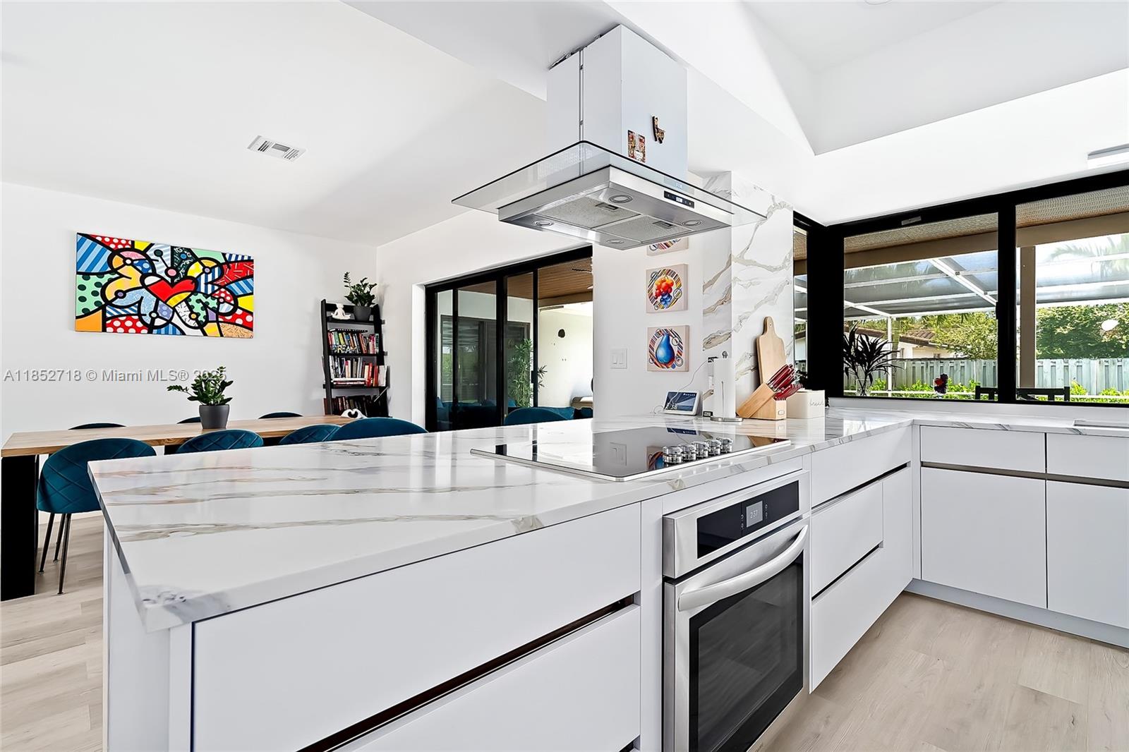 5100 Arthur Street Hollywood, FL 33021 - Photo 5 of 54 a kitchen with a sink and a stove top oven