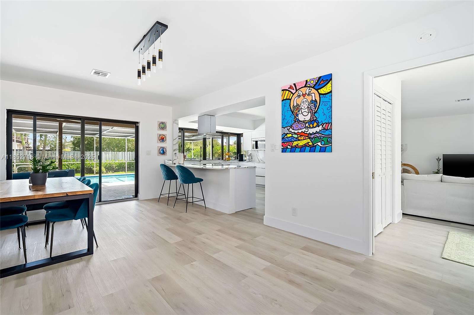 5100 Arthur Street Hollywood, FL 33021 - Photo 7 of 54 a living room with a couch and a table