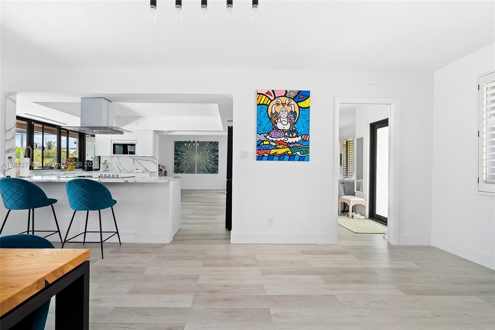 5100 Arthur Street Hollywood, FL 33021 - Photo 8 of 54 a living room with stainless steel appliances kitchen island granite countertop furniture and a couch