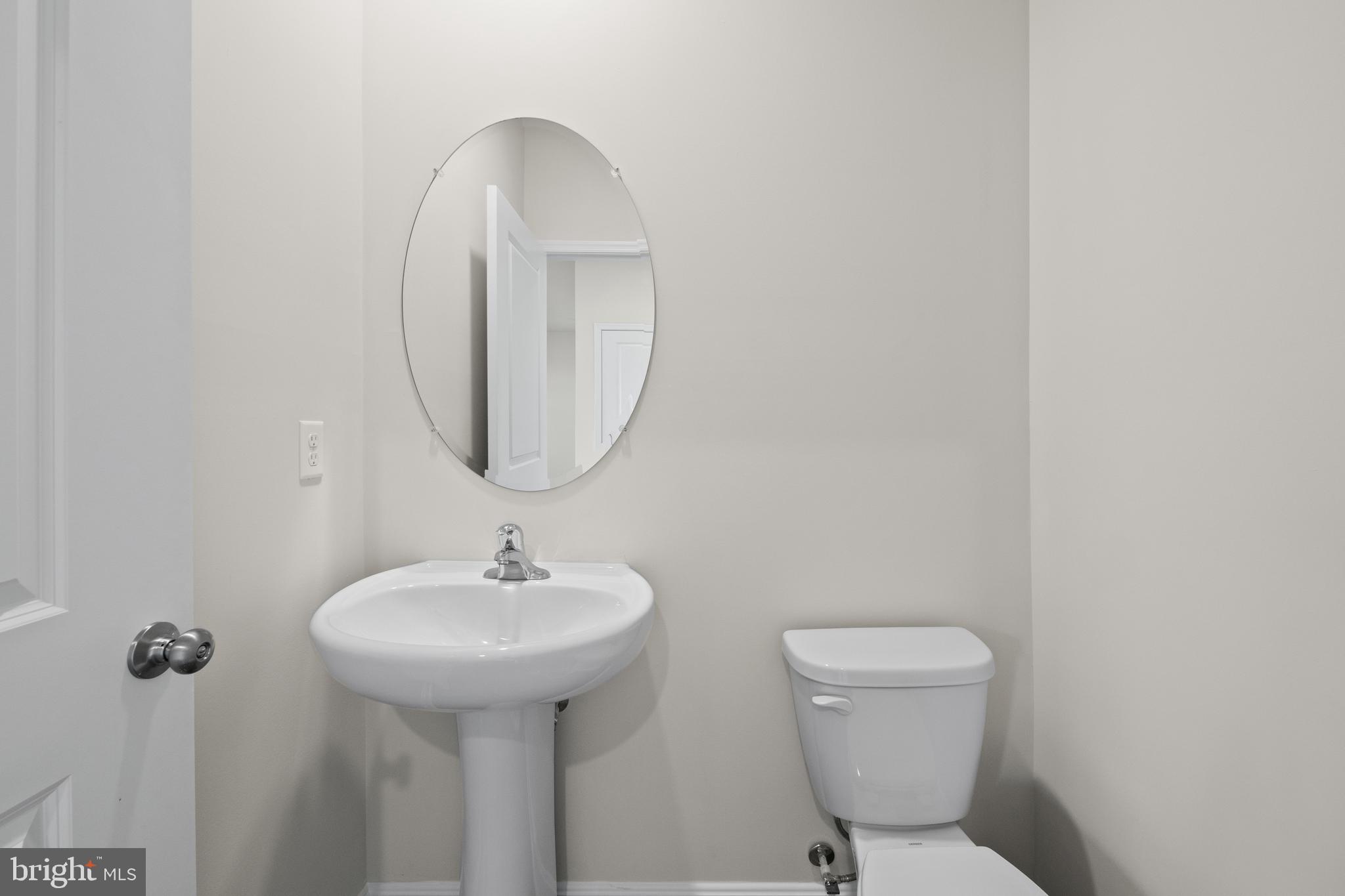 348 Eclipse Street Ranson, WV 25438 - Photo 21 of 29 a bathroom with a toilet sink and mirror
