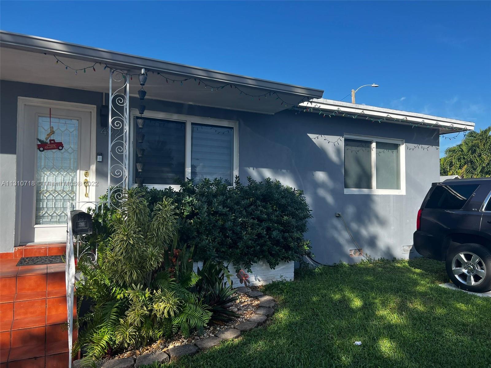 front view of a house with a small yard