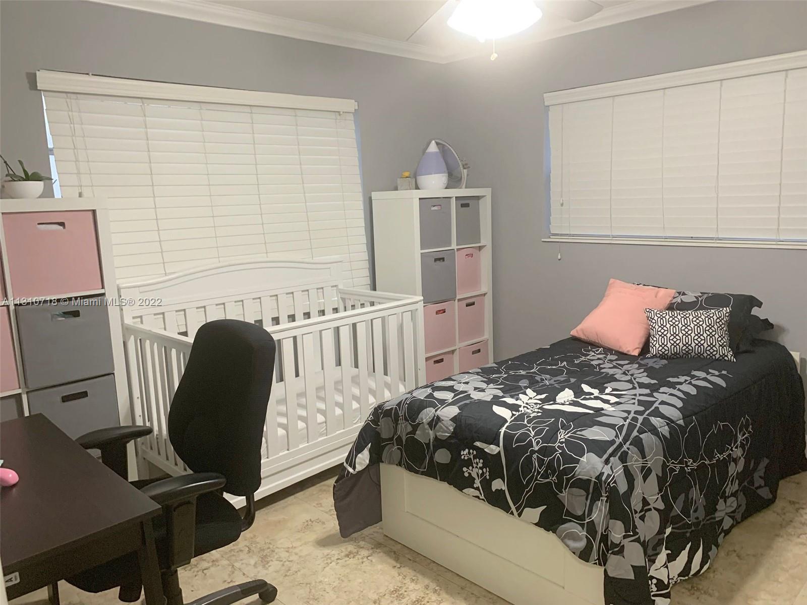 Flagami Miami, FL 33126 - Photo 11 of 21 a bedroom with a bed chair and a window