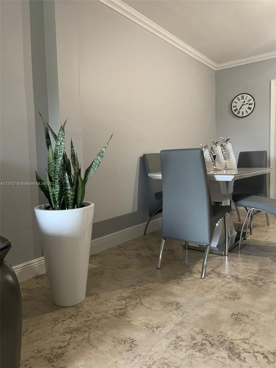 Flagami Miami, FL 33126 - Photo 13 of 21 a view of a dining room with furniture and a potted plant