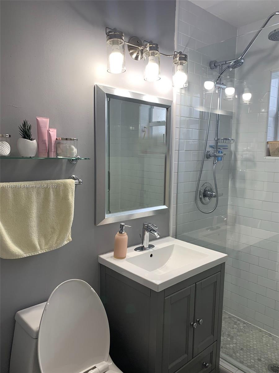 Flagami Miami, FL 33126 - Photo 18 of 21 a bathroom with a sink mirror and toilet