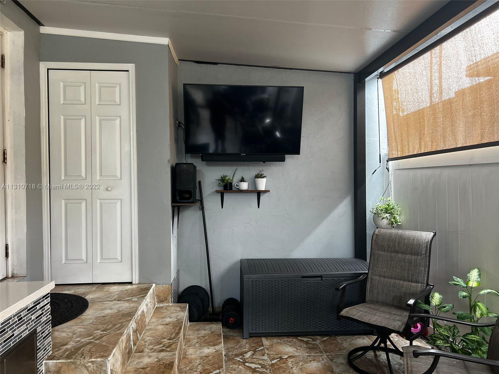 Flagami Miami, FL 33126 - Photo 2 of 21 a bedroom with a bed a flat screen tv and a window