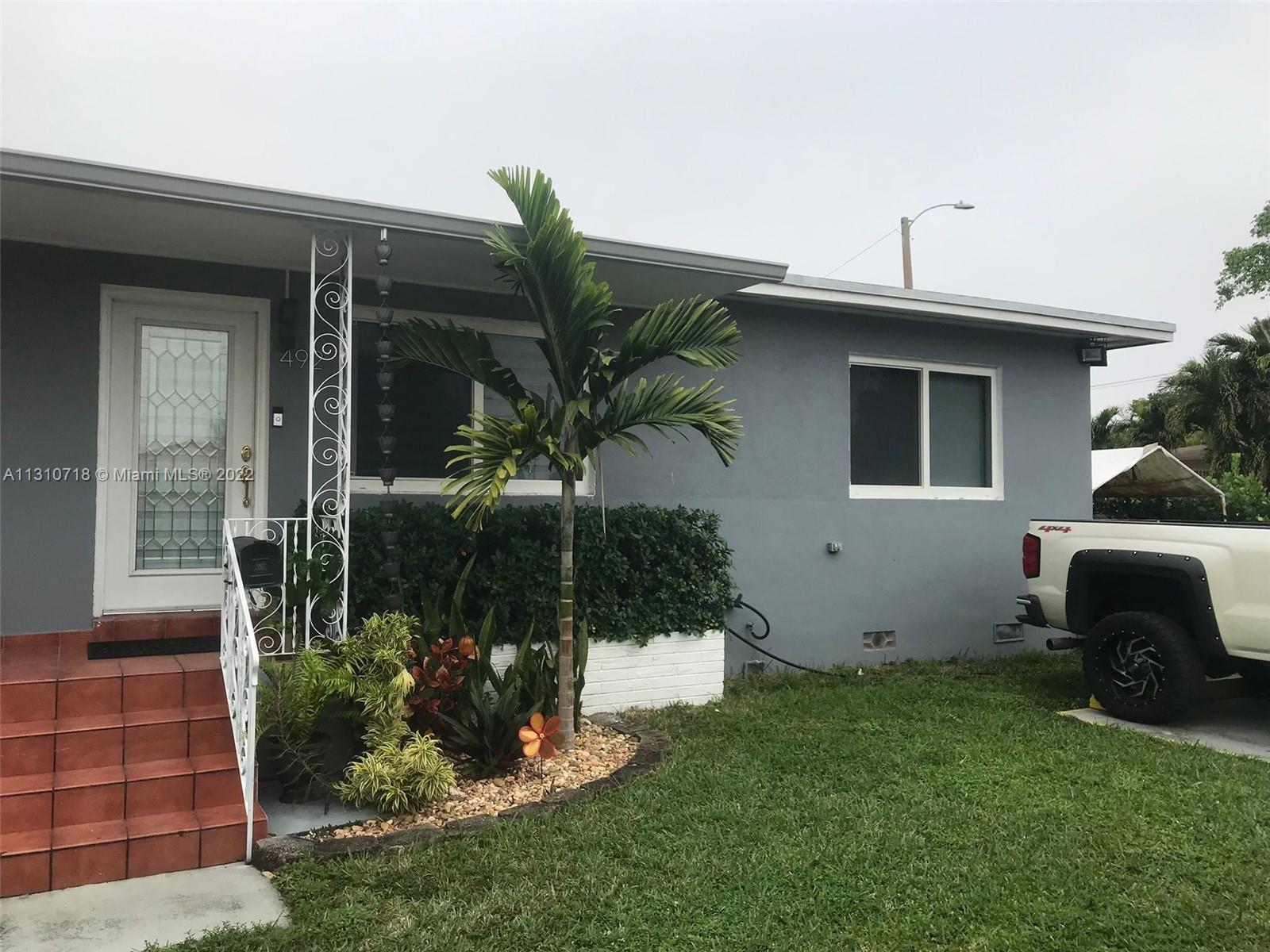 Flagami Miami, FL 33126 - Photo 7 of 21 a front view of a house with garden
