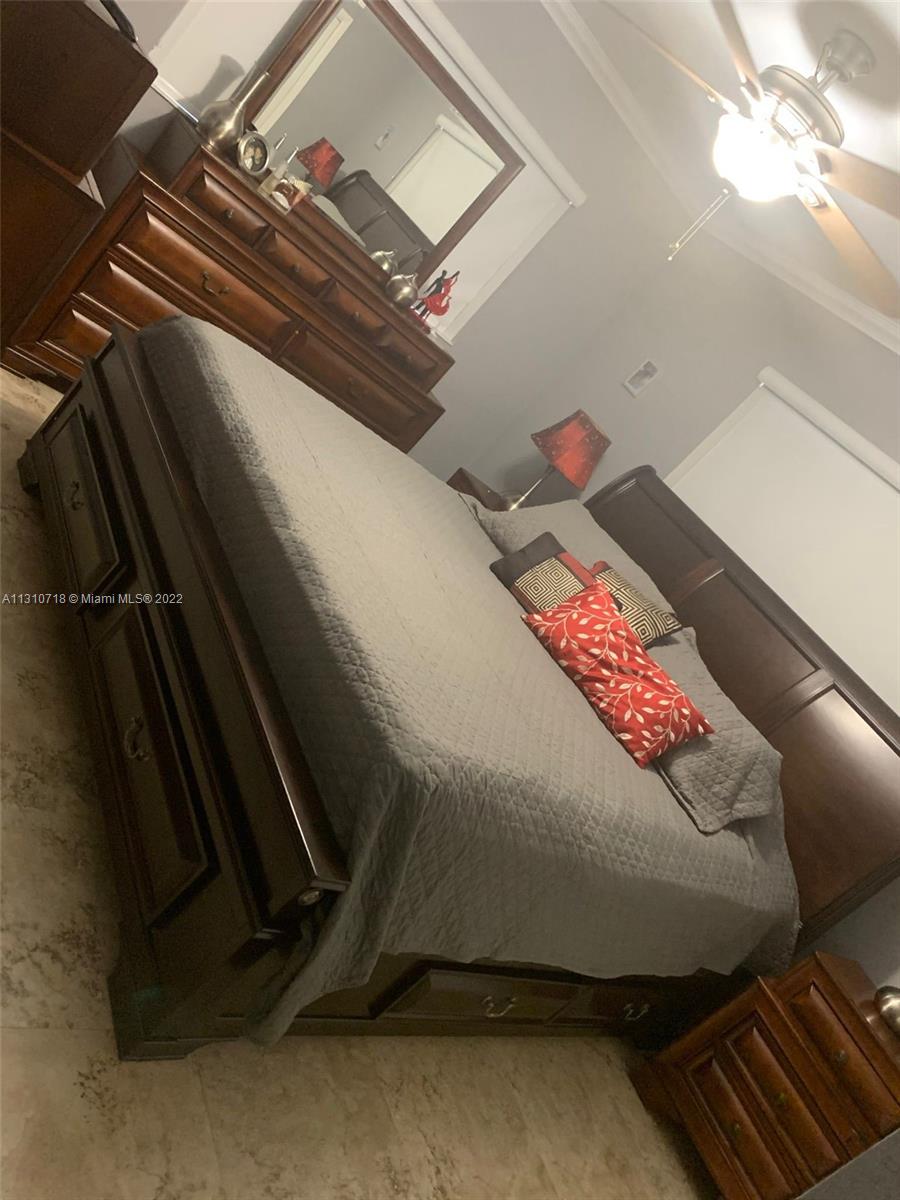 Flagami Miami, FL 33126 - Photo 8 of 21 a living room with blue lights with furniture