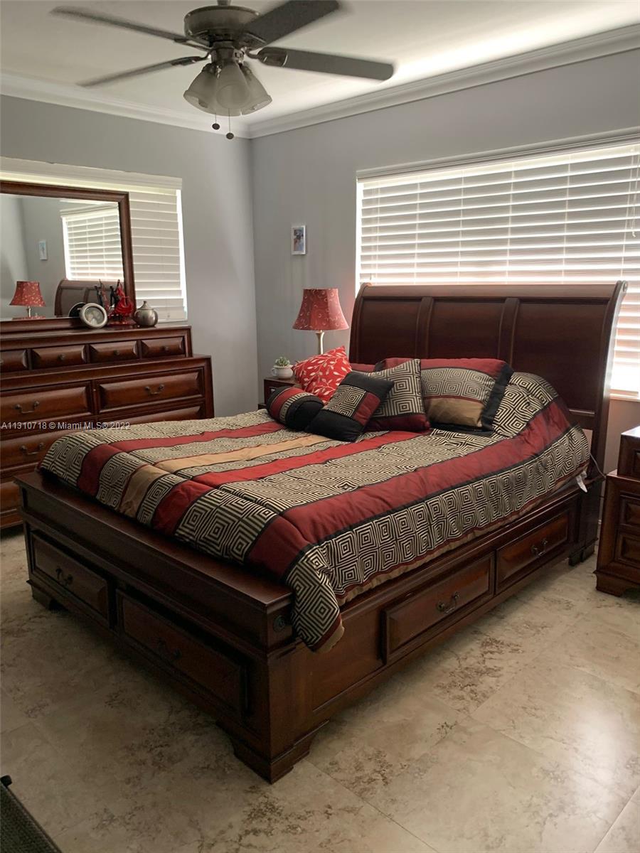 Flagami Miami, FL 33126 - Photo 9 of 21 a bedroom with a bed and wooden floor