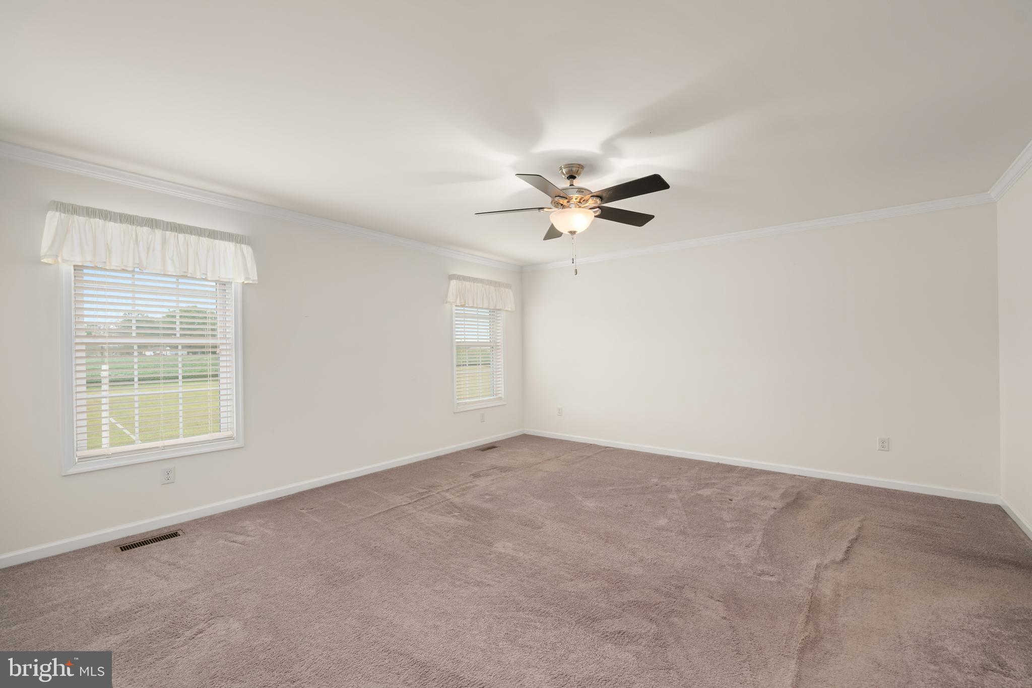 17002 Oak Road Bridgeville, DE 19933 - Photo 11 of 33 an empty room with windows and fan