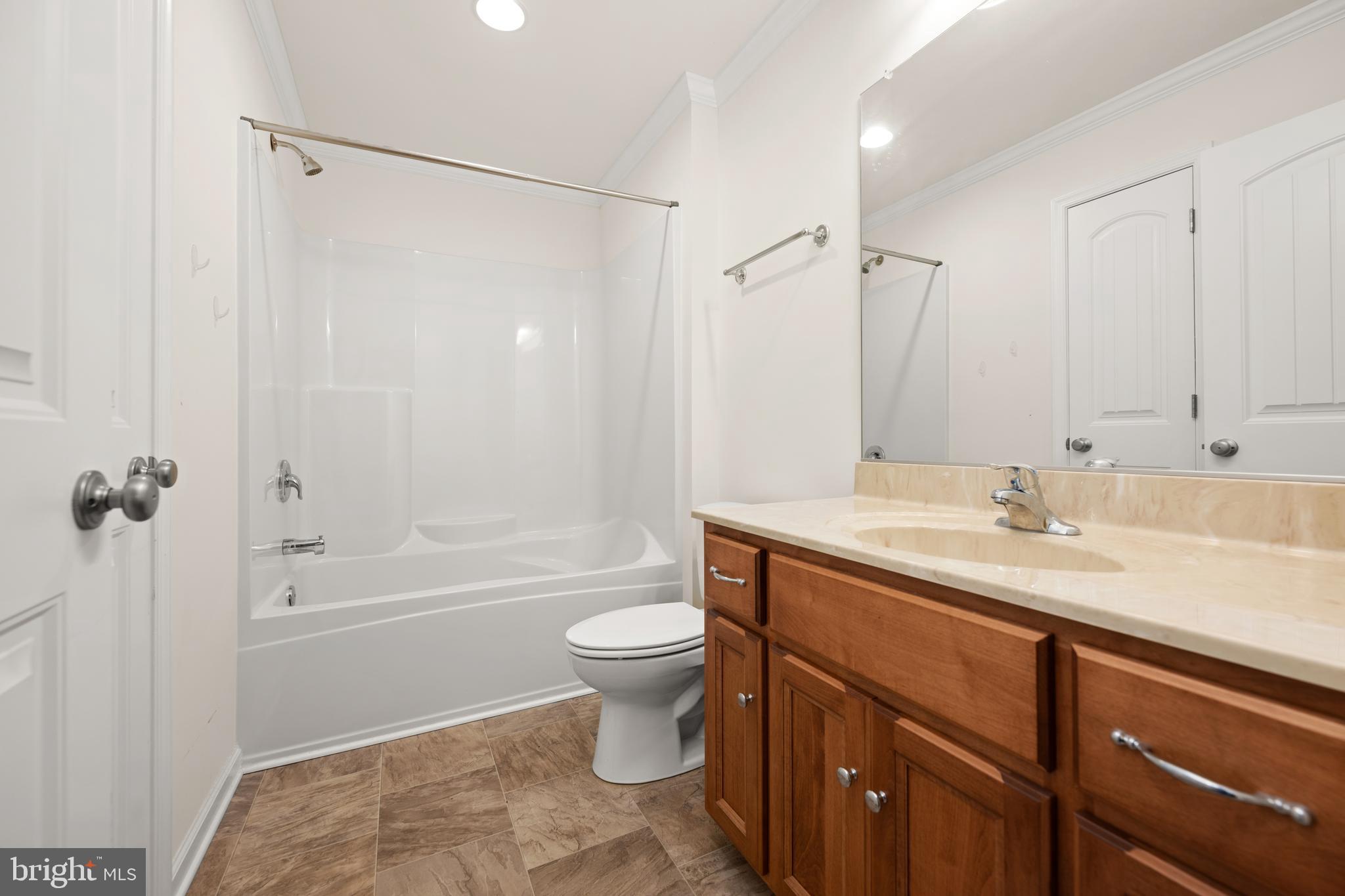 17002 Oak Road Bridgeville, DE 19933 - Photo 19 of 33 a bathroom with a granite countertop sink toilet and shower