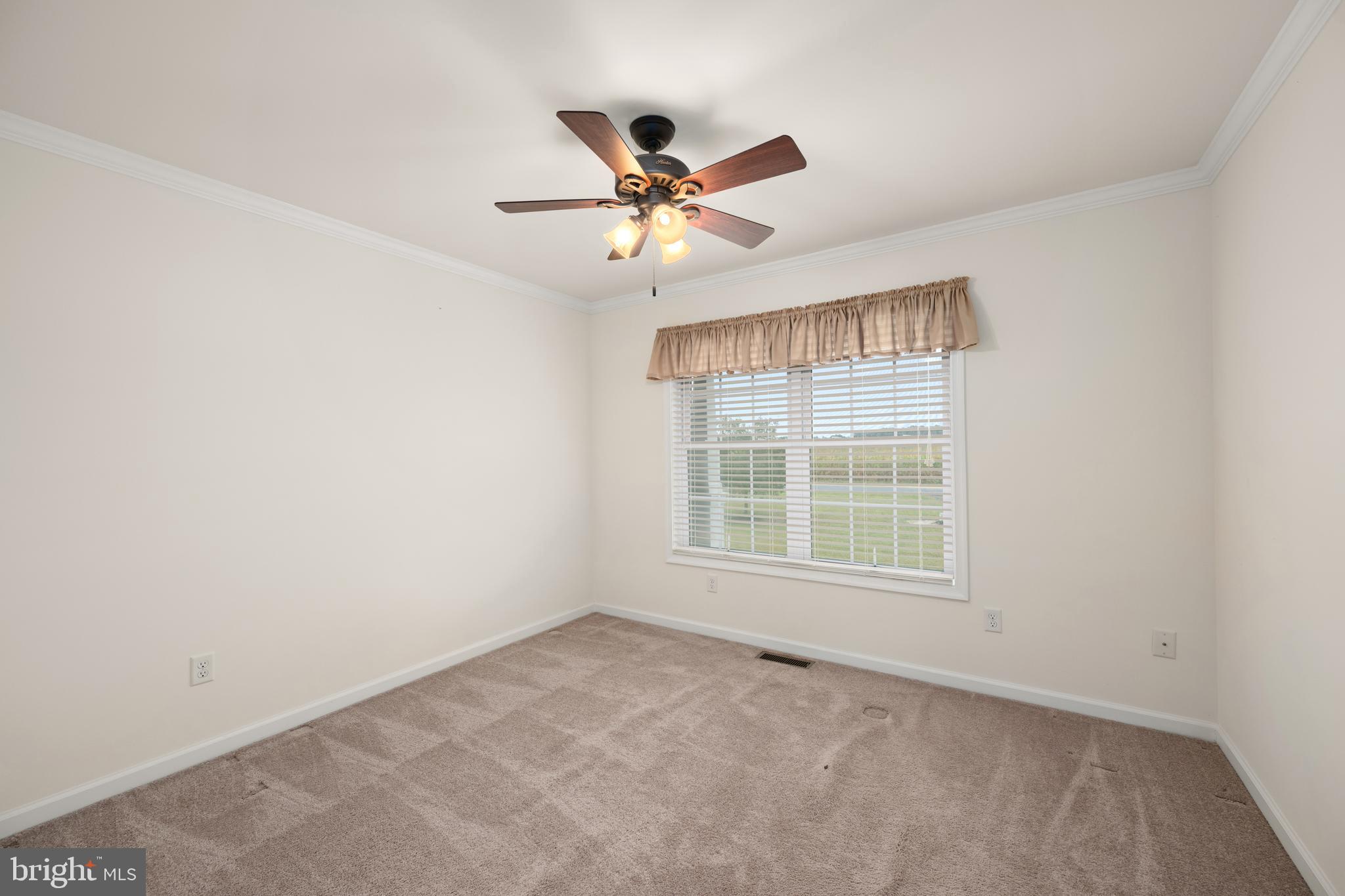 17002 Oak Road Bridgeville, DE 19933 - Photo 20 of 33 an empty room with windows and fan
